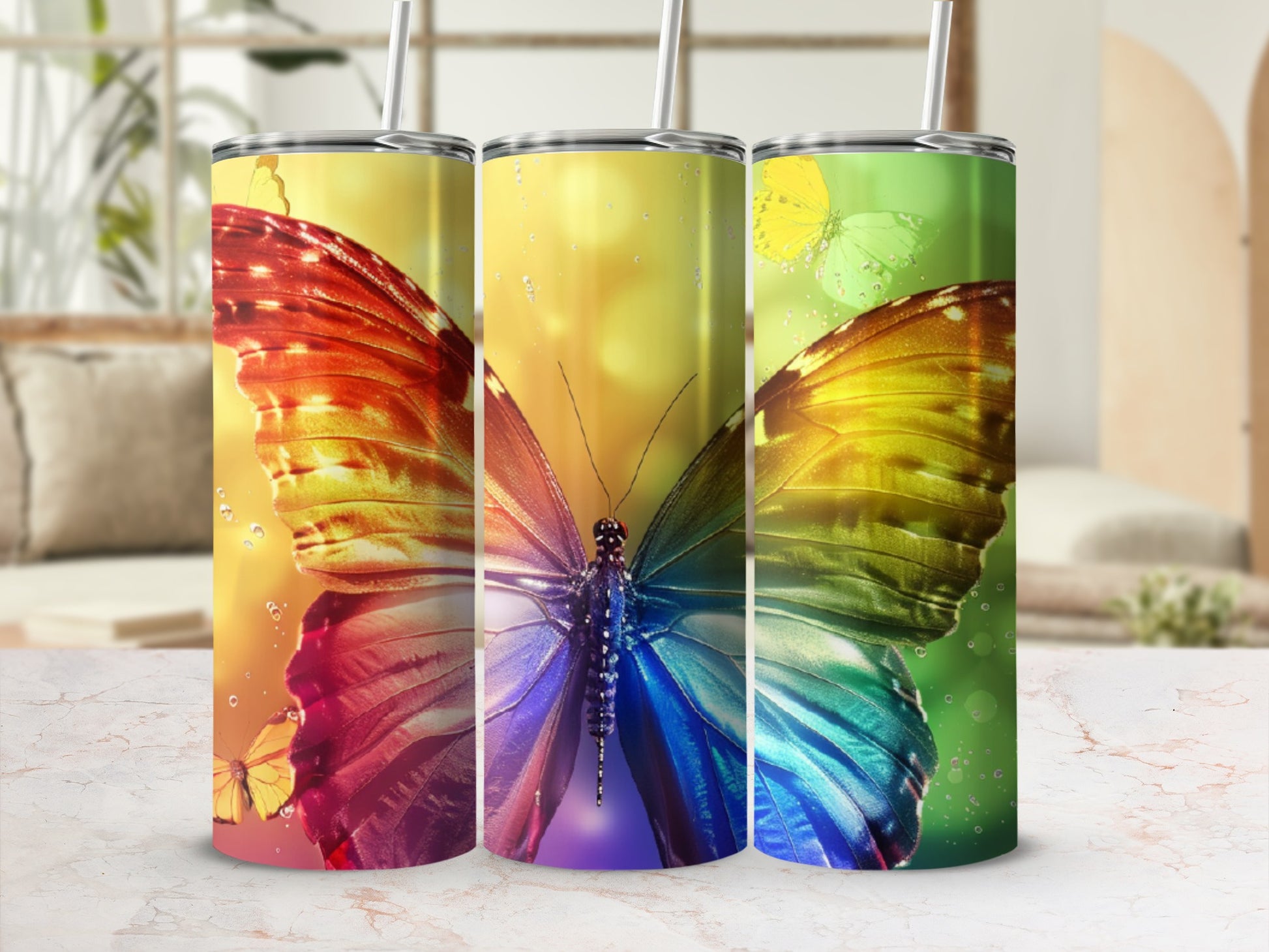 Three colorful butterfly tumblers with bokeh background.