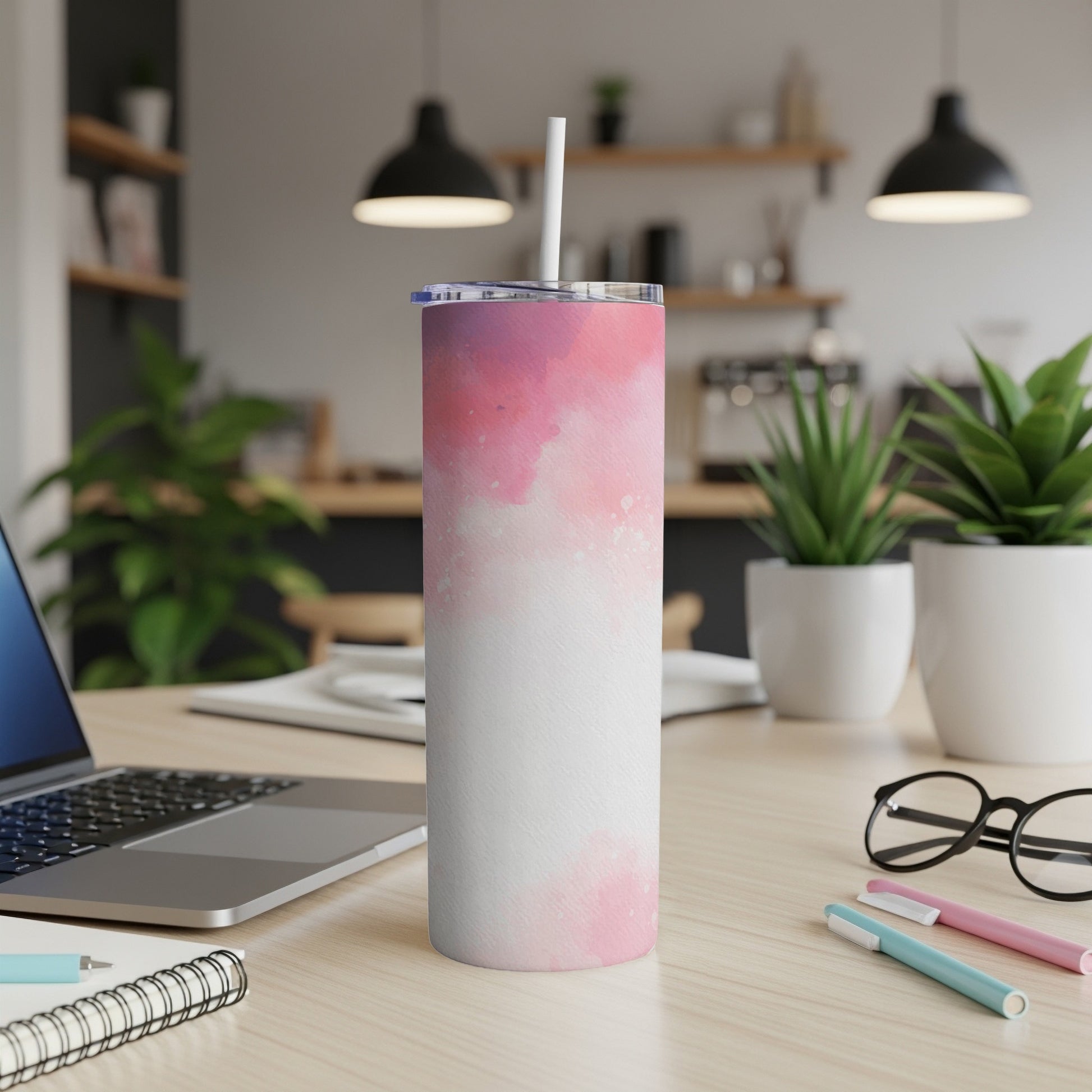 White tumbler with pink watercolor splash pattern.