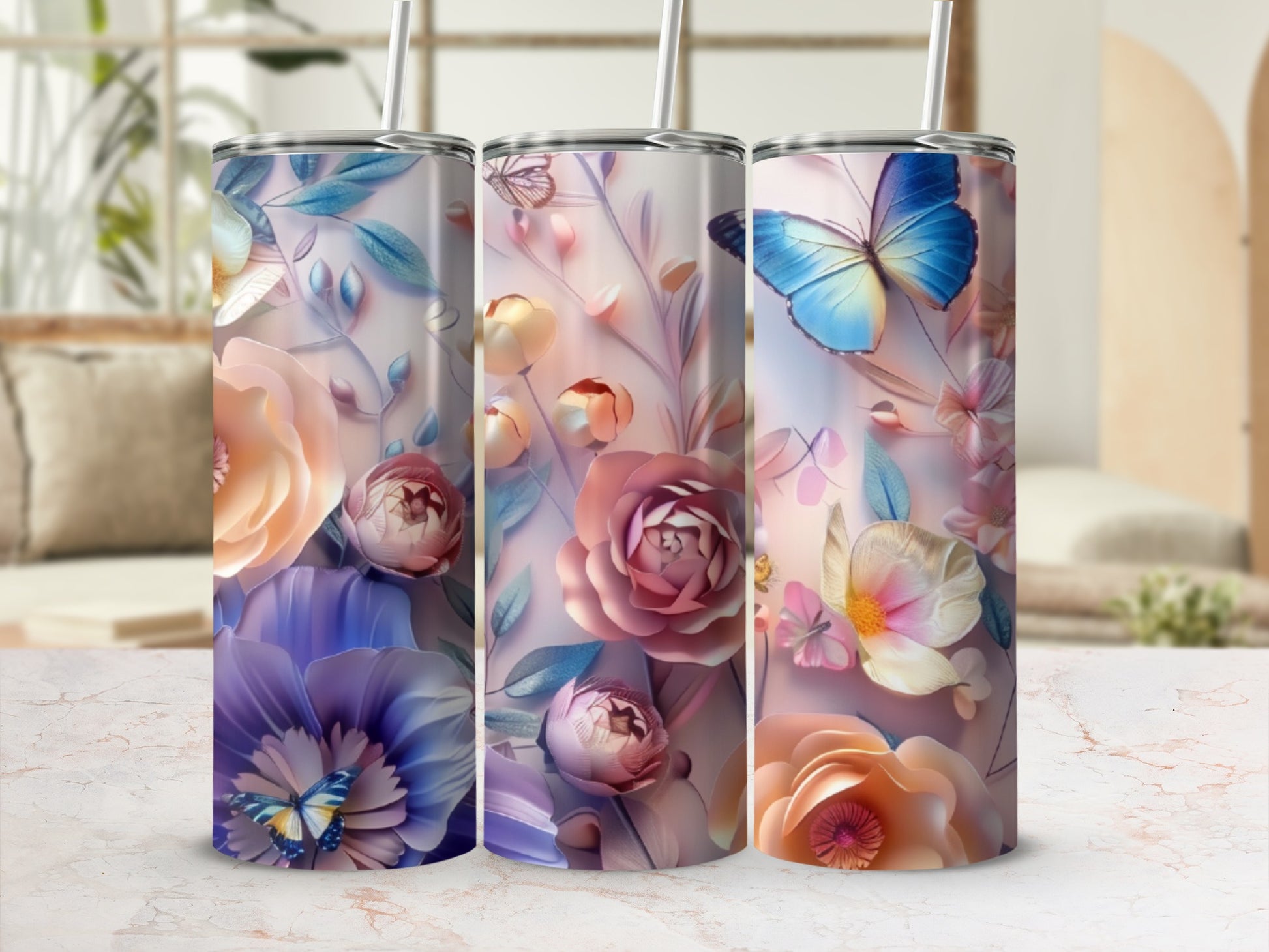 Three tumblers with floral and butterfly designs.