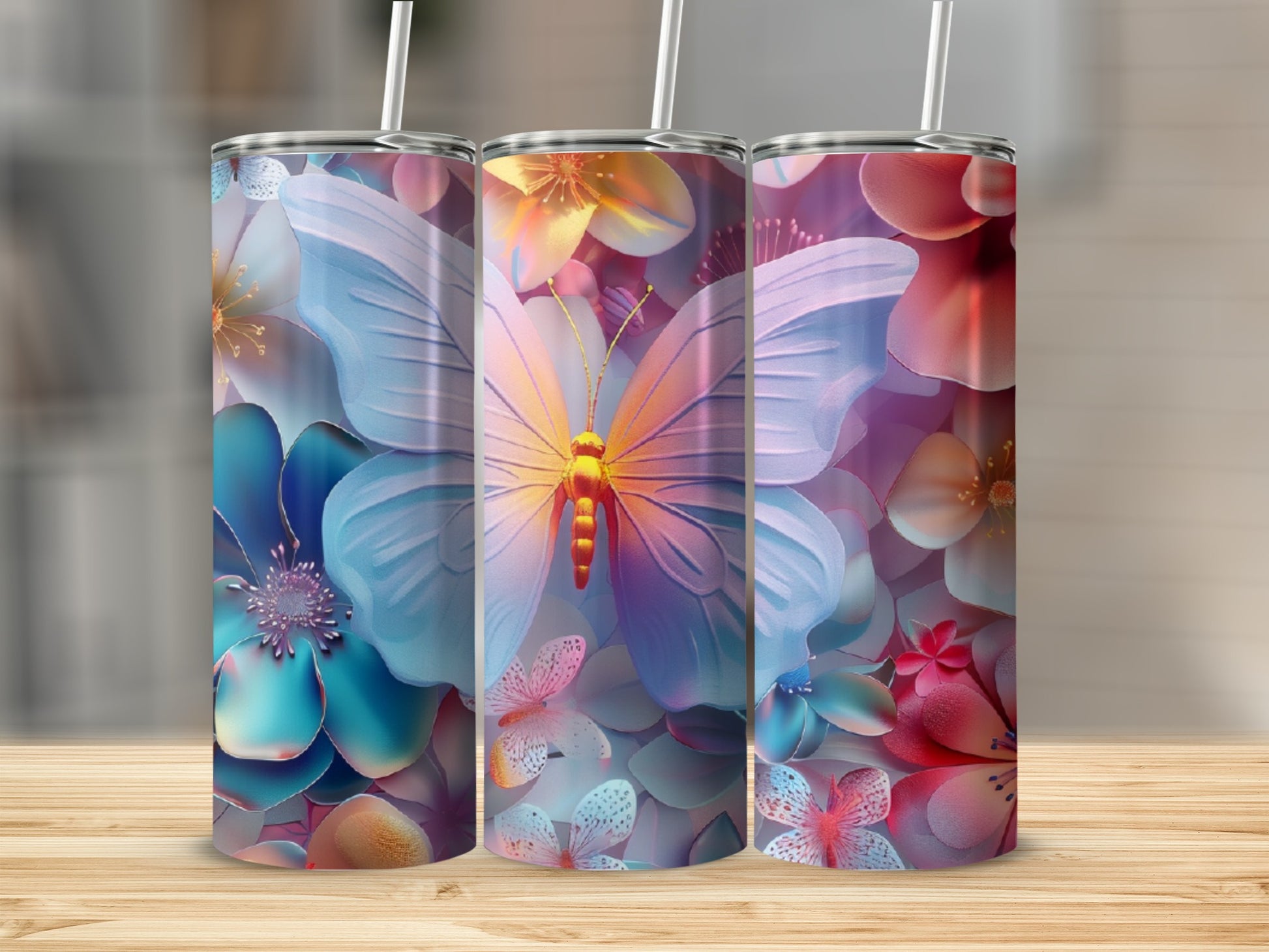 Three tumblers with vibrant floral and butterfly designs.