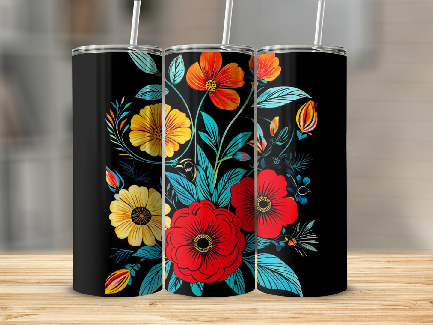 Three black tumblers with a vibrant floral pattern featuring red, orange, and yellow flowers.