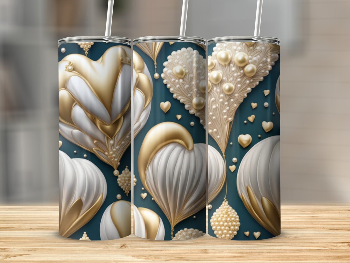 Three tumblers with gold and white hearts and pearl details on teal background.