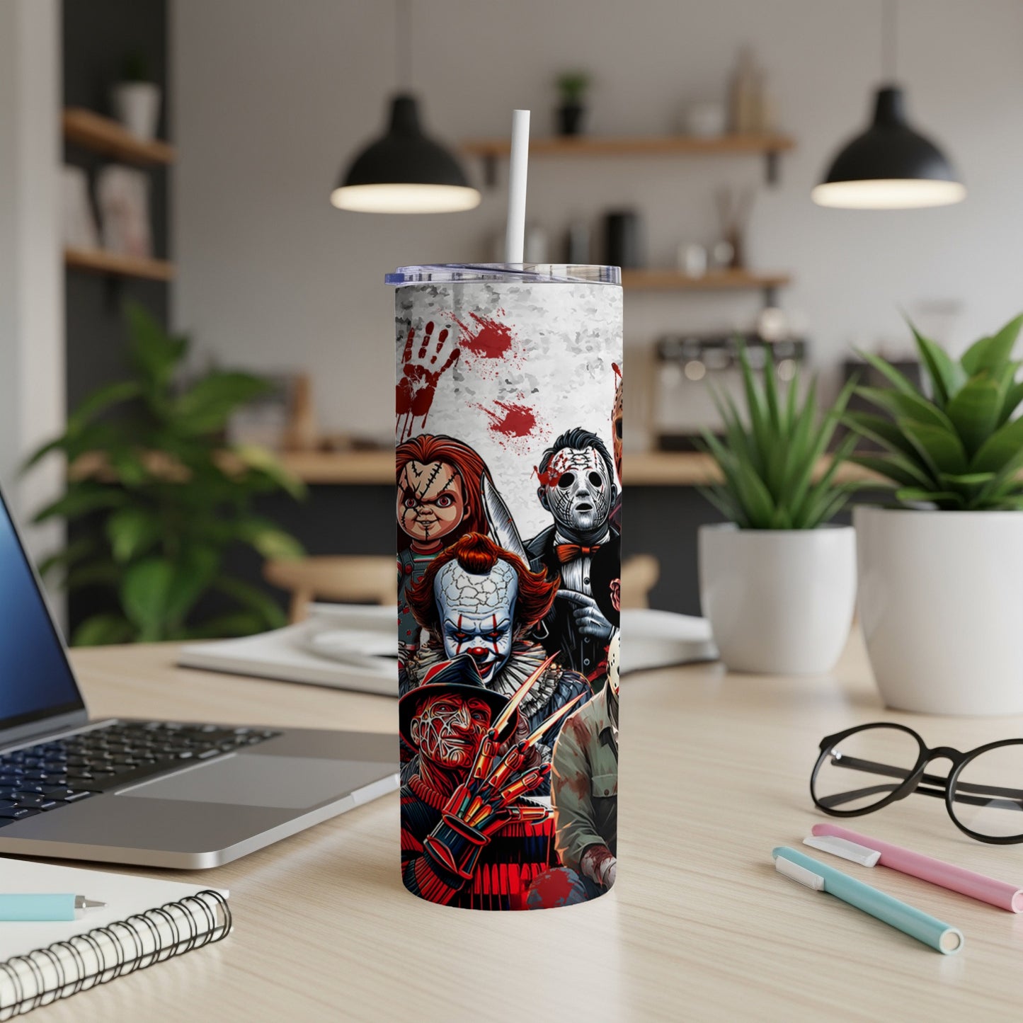 Horror movie villains on a white tumbler with red handprints.