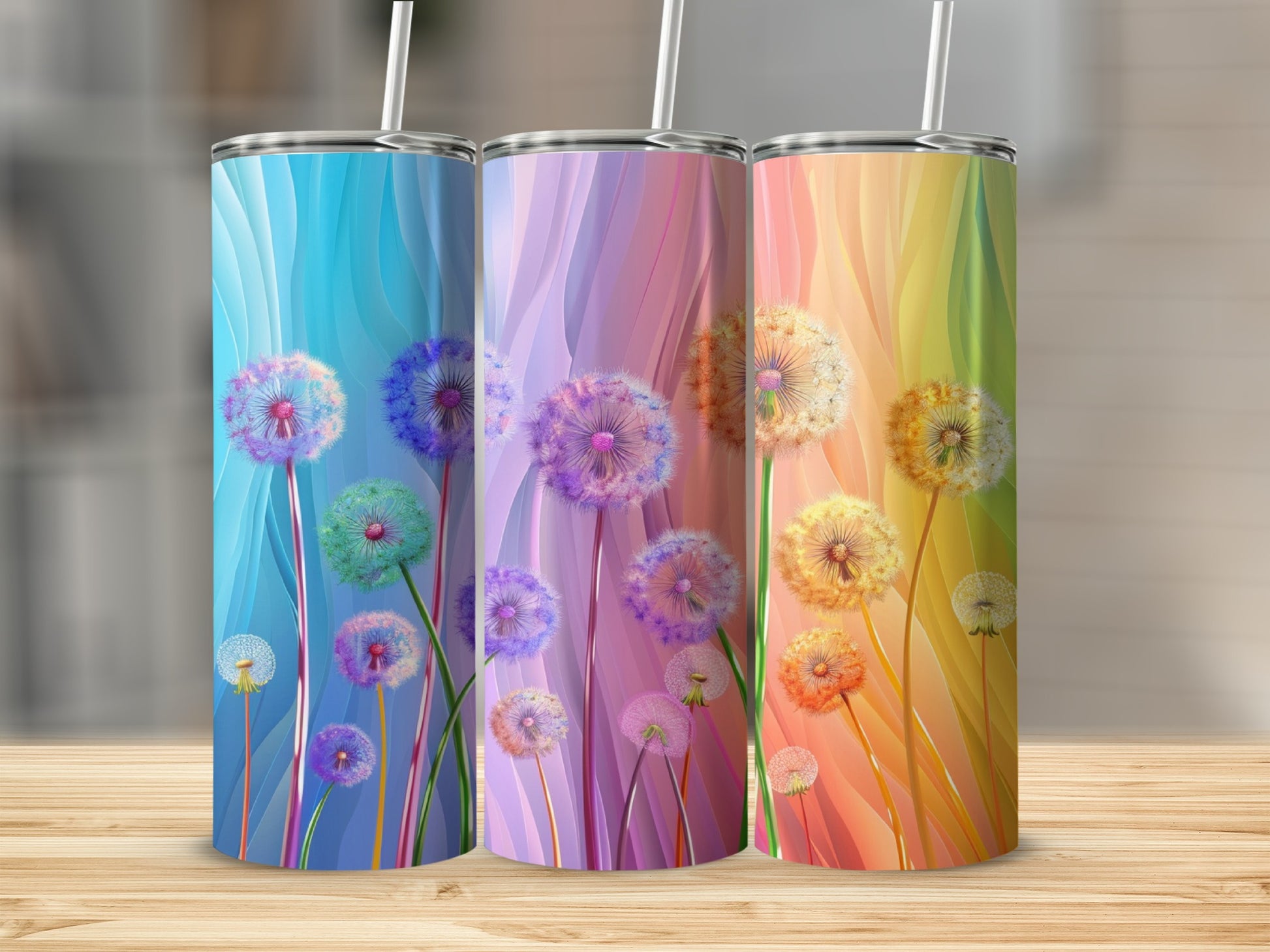 Three tumblers with dandelion designs in blue, purple, and yellow color schemes.