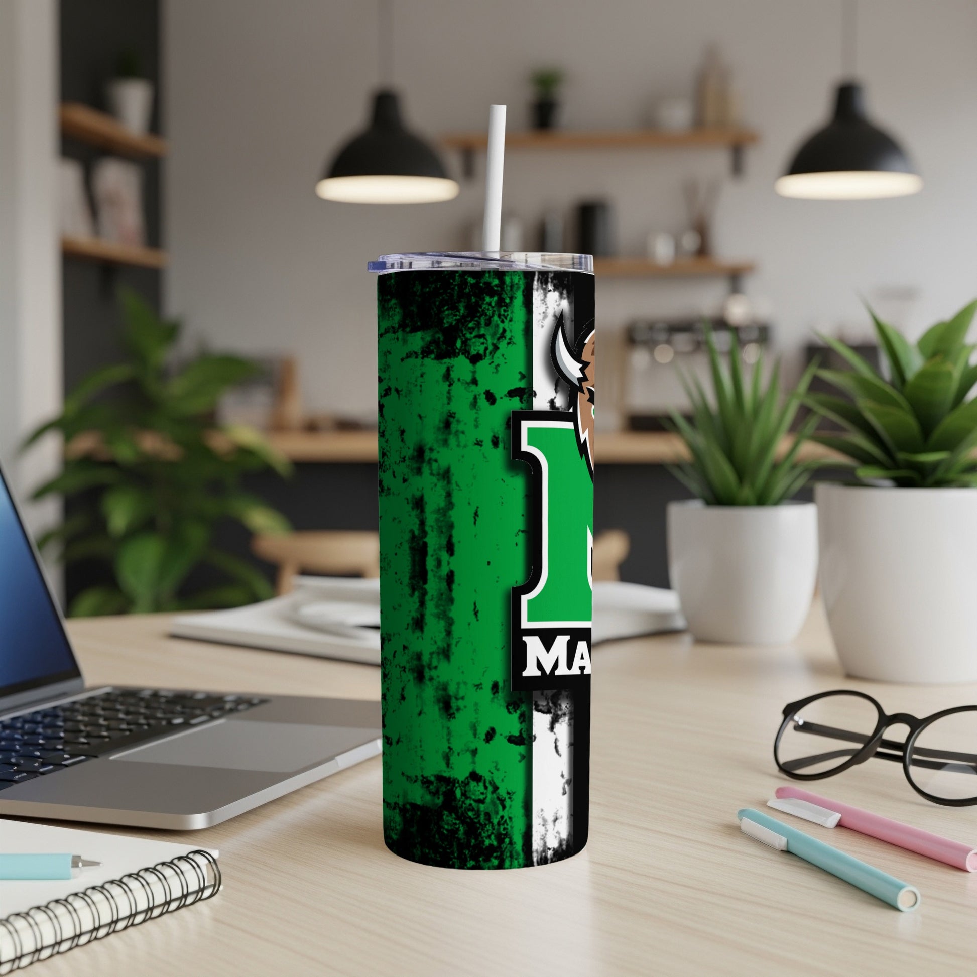 Tumbler with green, black, and white design, featuring "1" and "MA".
