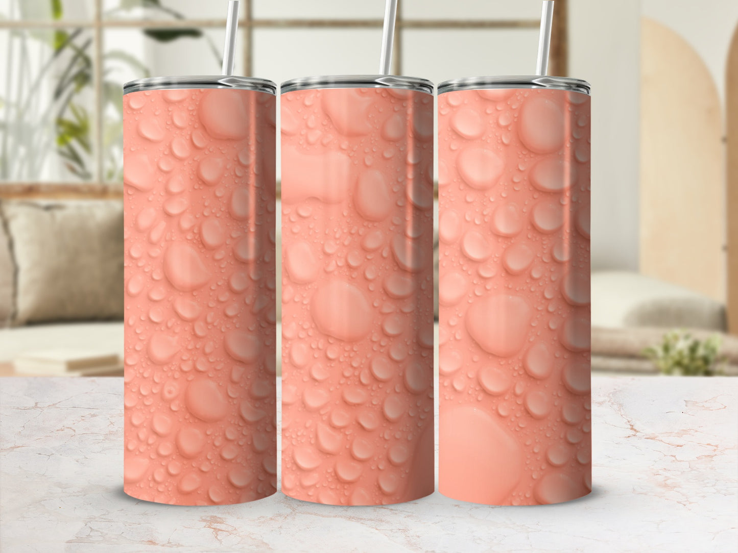 Three tall, coral-colored tumblers with a realistic water droplet pattern.