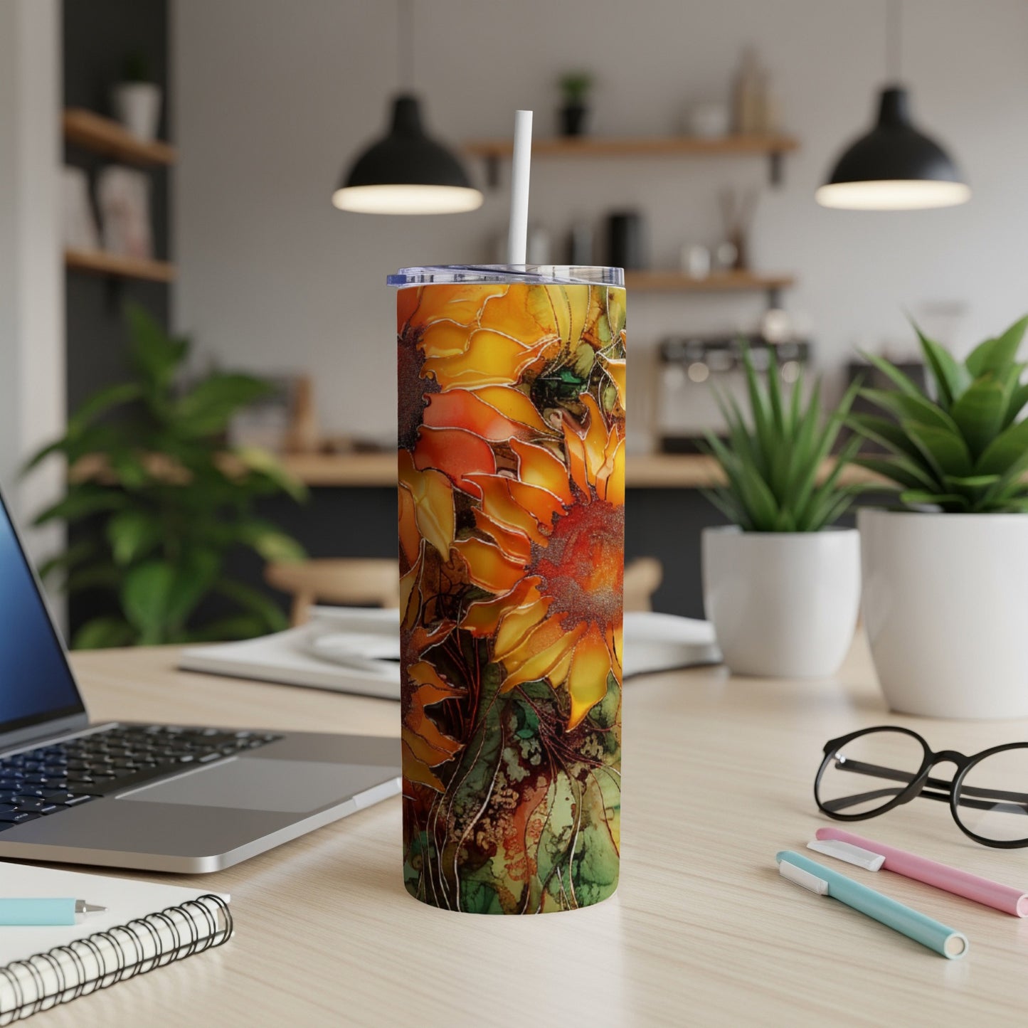 Tumbler with a vibrant sunflower and leaf pattern.