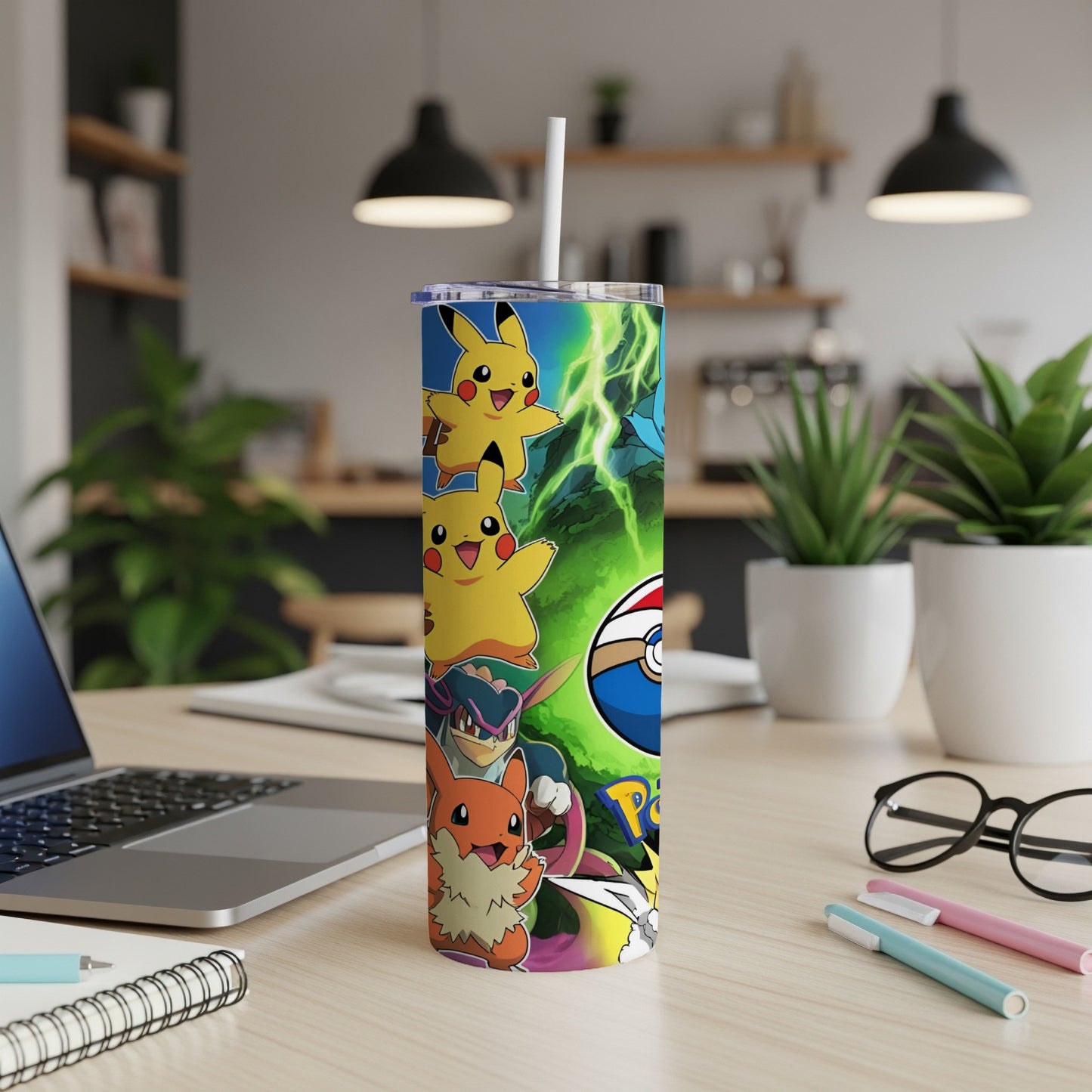 Pikachu and other Pokemon characters on a green and blue patterned tumbler with a straw.