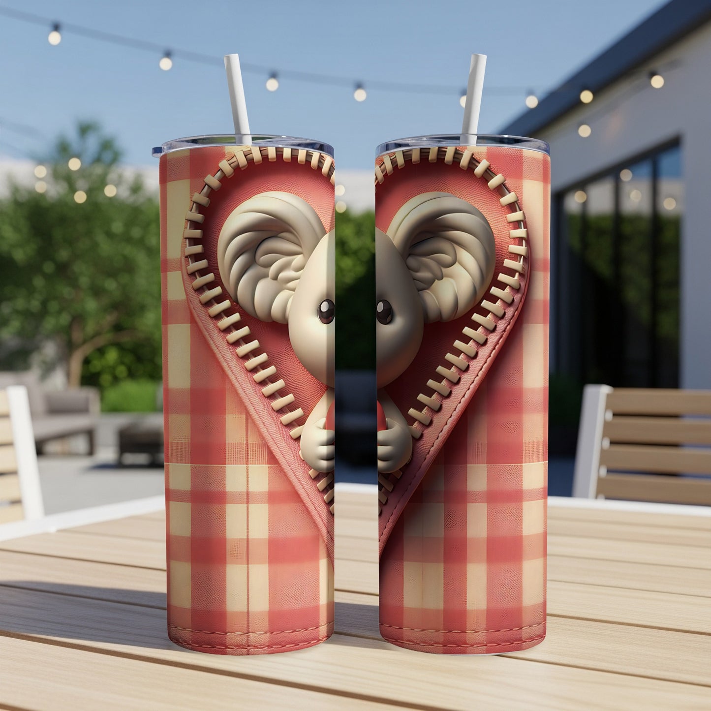 Two tumblers with a zipper revealing a koala peeking out from a heart.