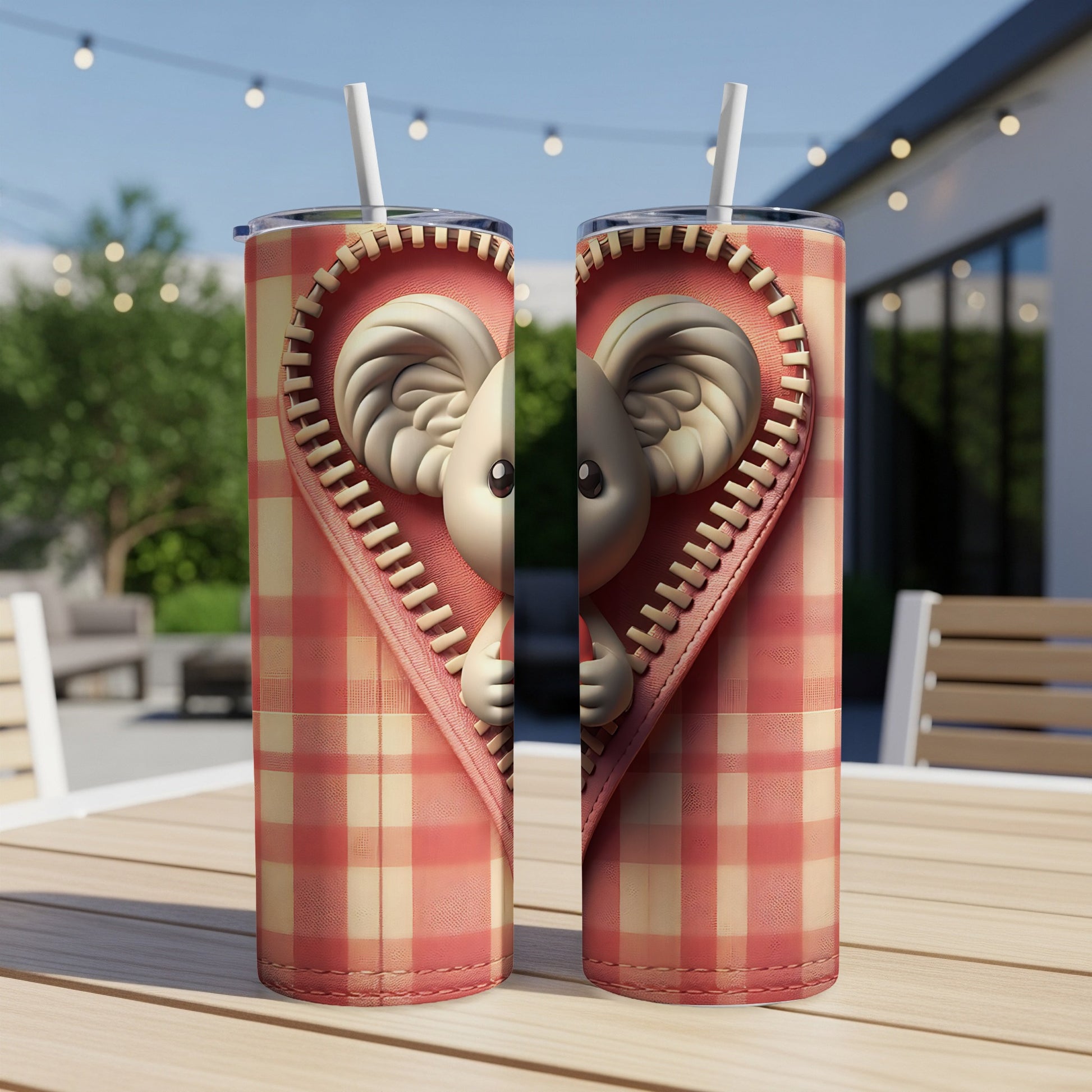 Two tumblers with a zipper revealing a koala peeking out from a heart.