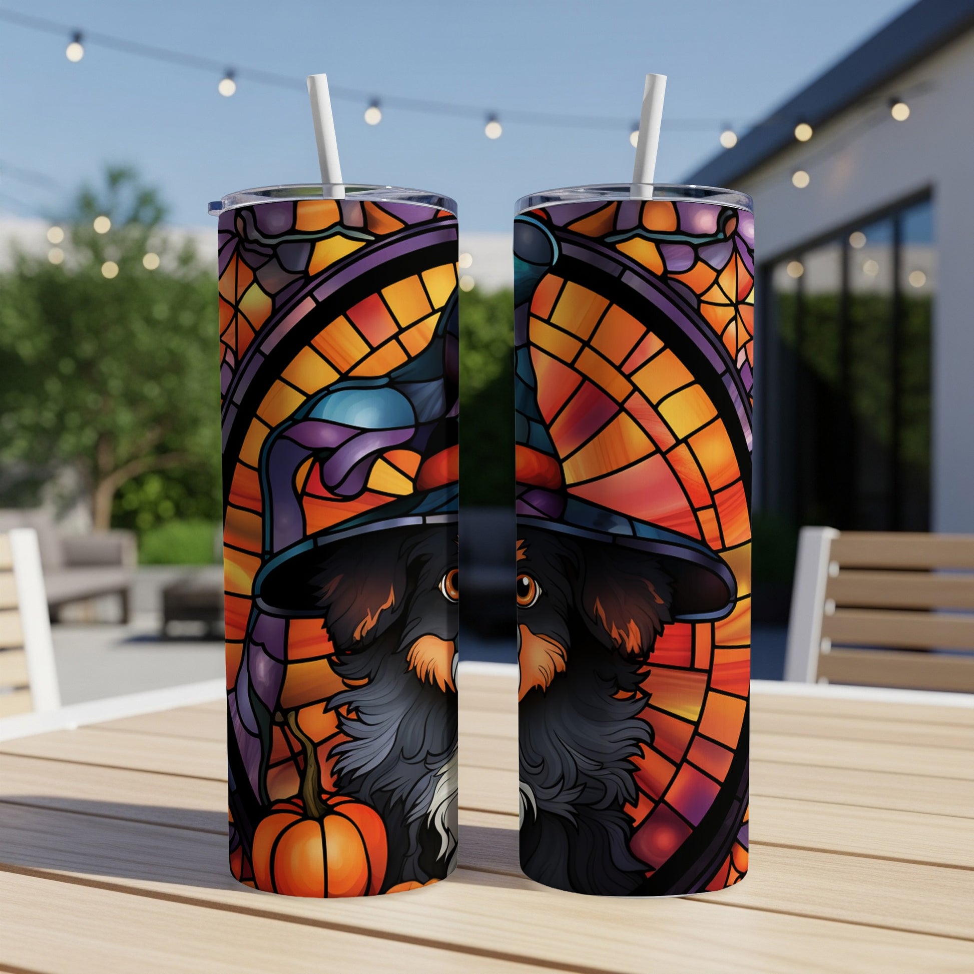 Two Halloween tumblers with a witch hat dog and stained glass design.