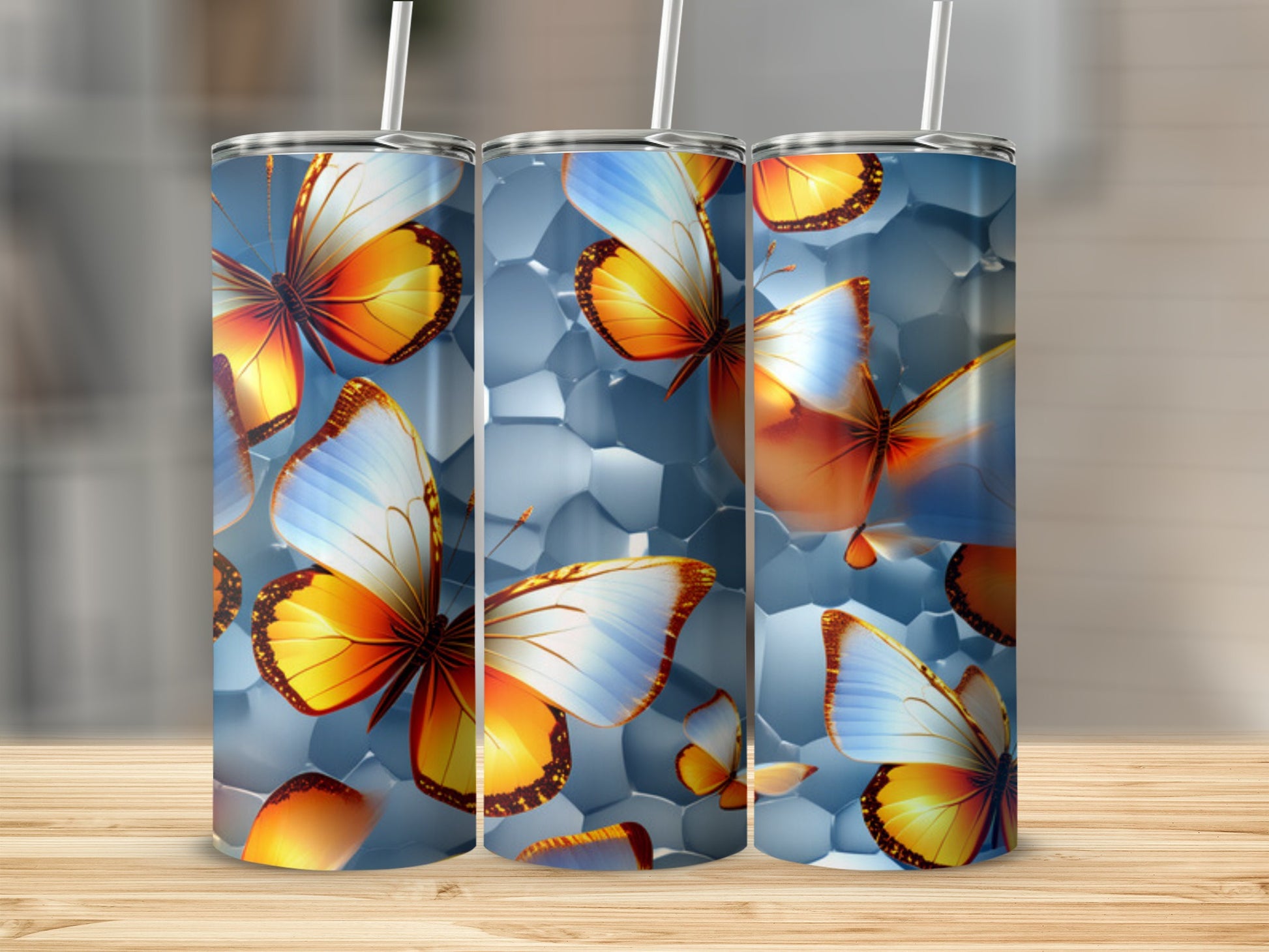 Three tumblers with butterfly and geometric patterns.