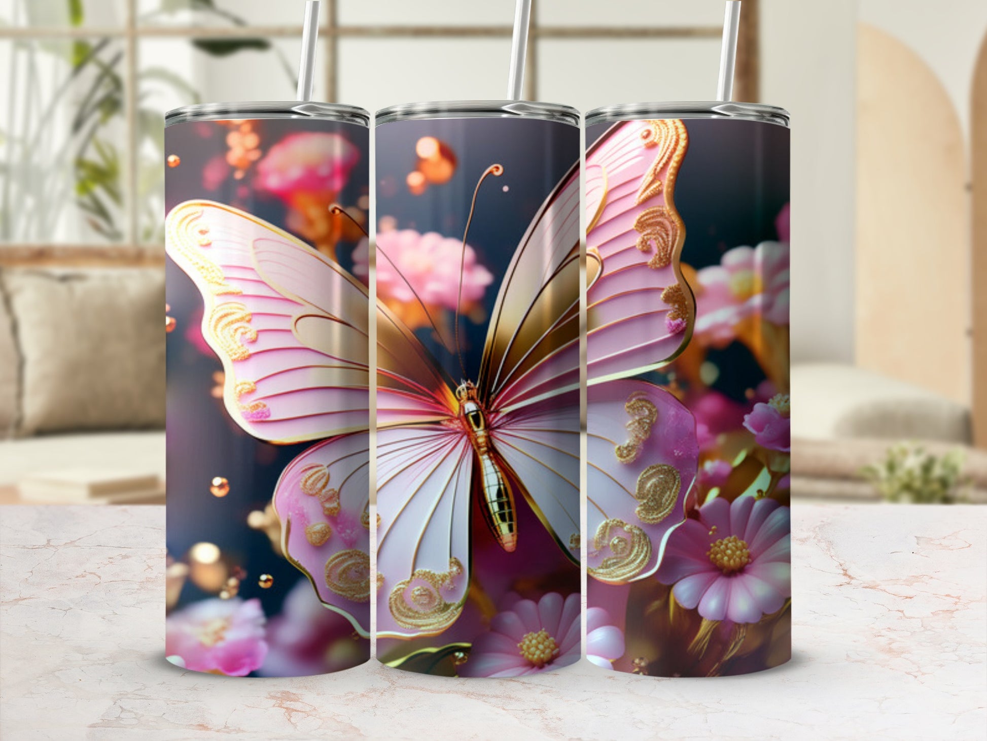Pink and gold butterfly design on three tumblers with blurred background.