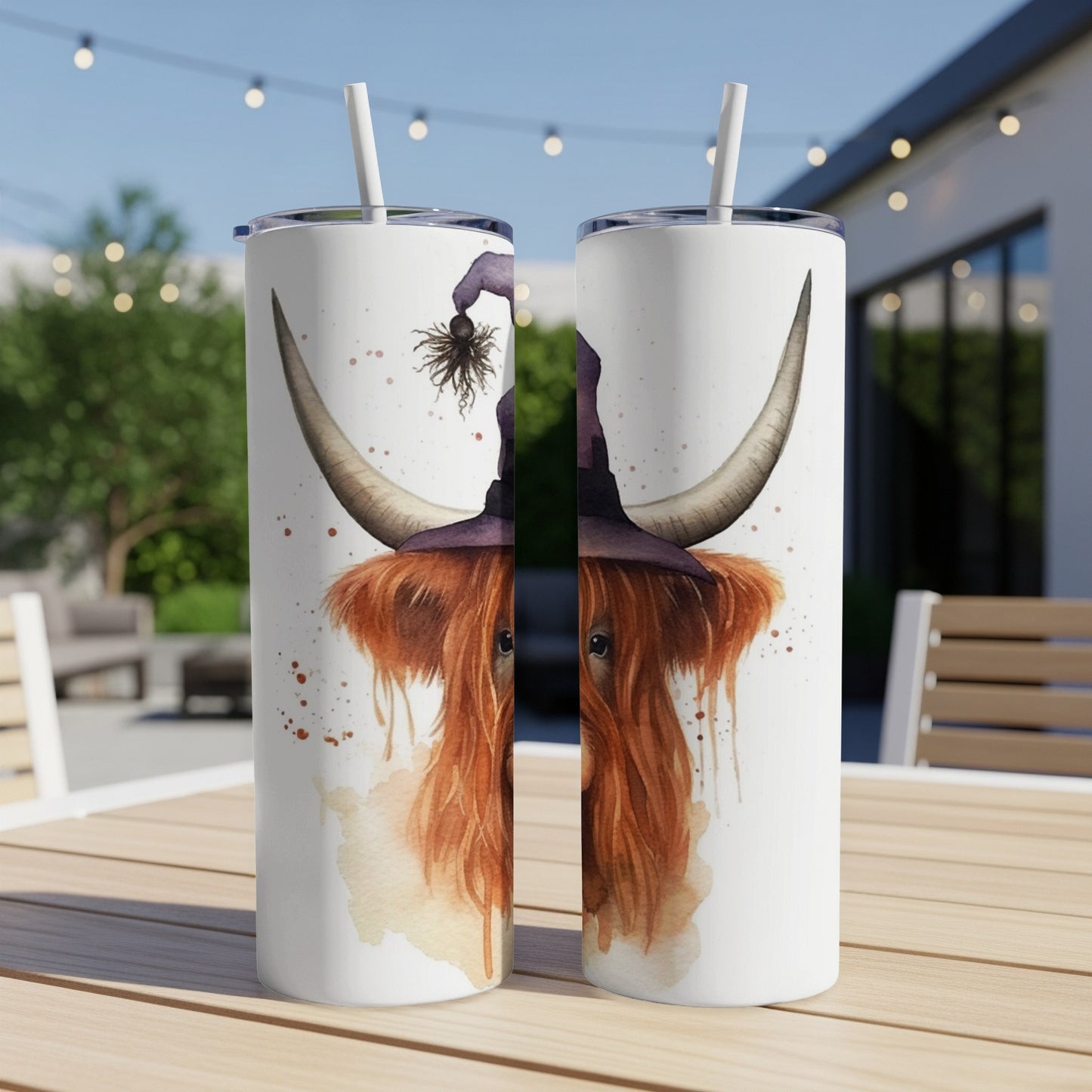 Highland cow wearing witch hat with spider on it, on tumbler.