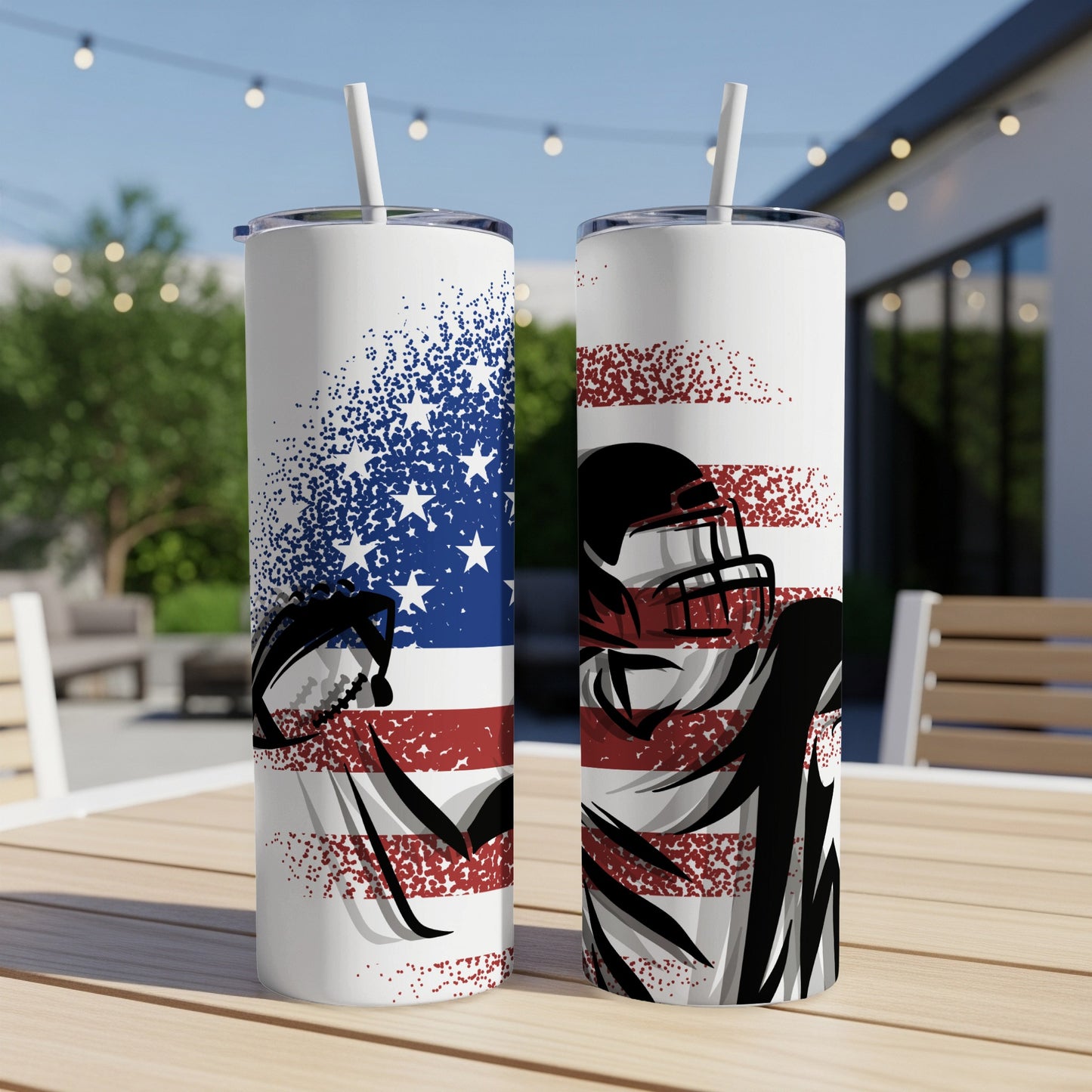 Two tumblers with American flag and football helmet graphics on a table.
