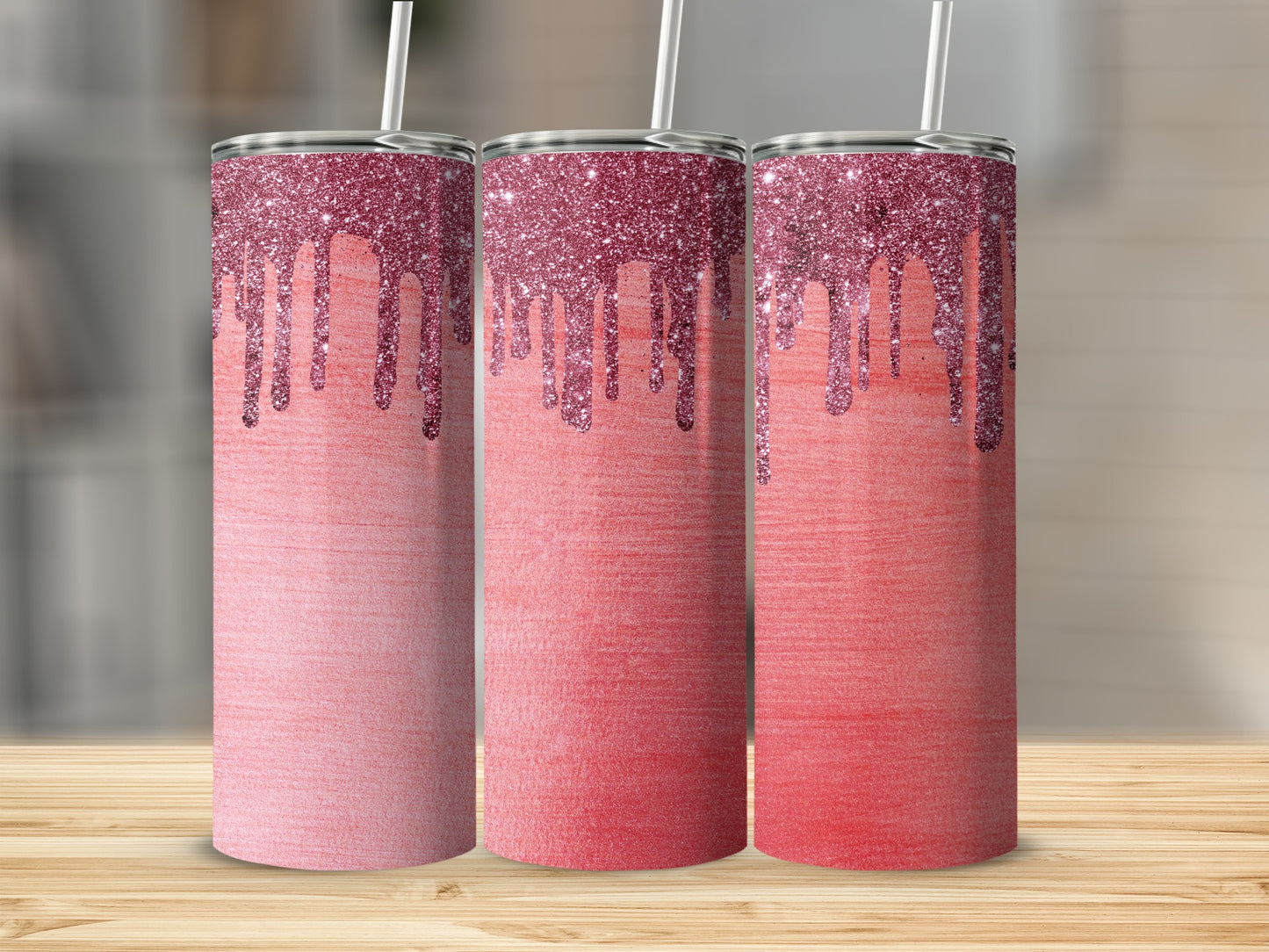 Three tall tumblers with pink glitter dripping onto ombre red gradient design.