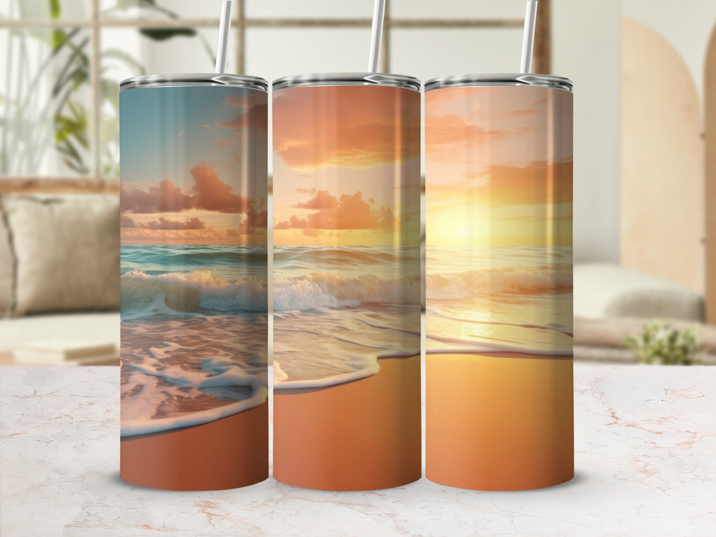 Three tumblers with sunset beach scene graphics, straws inserted.