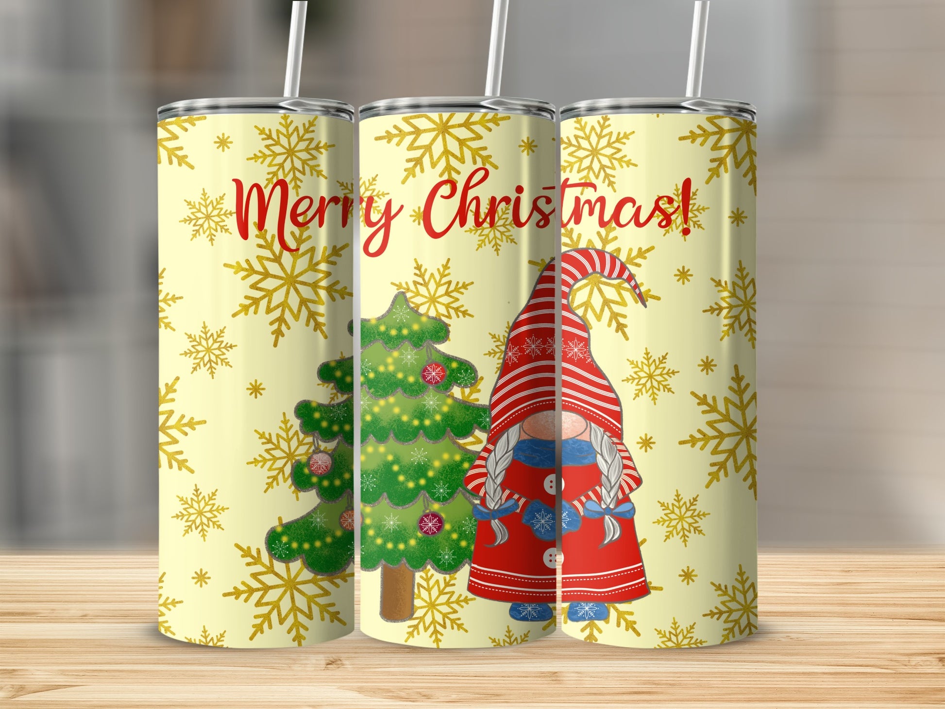 Three tumblers with Christmas tree and gnome design and "Merry Christmas" text.