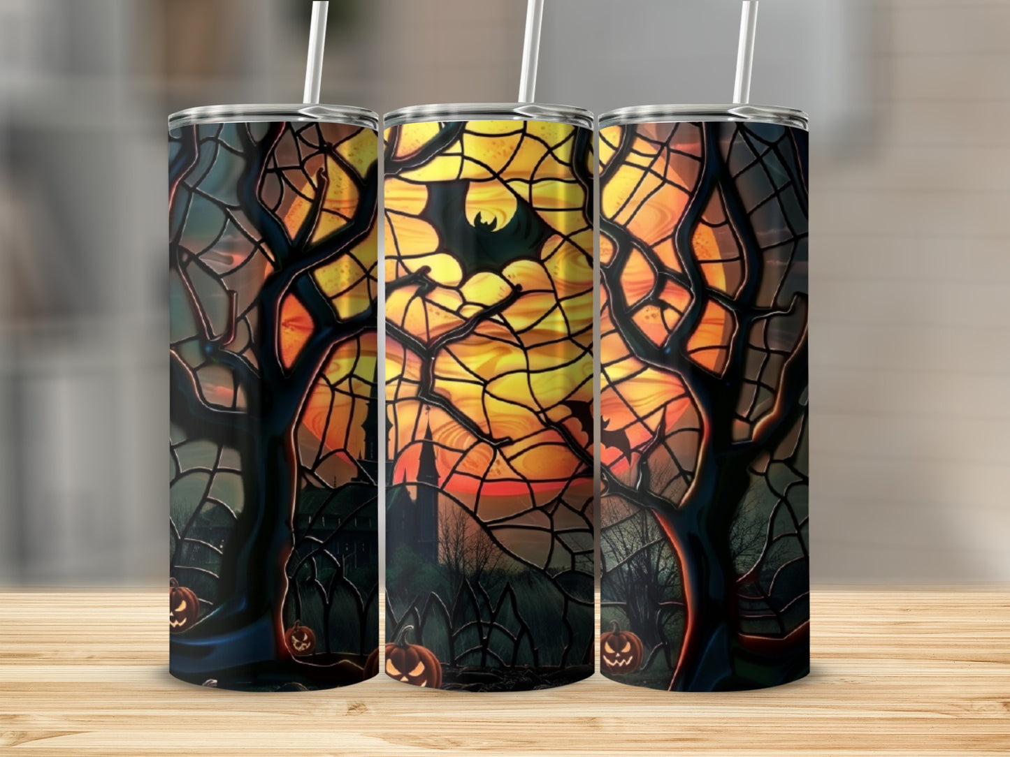 Halloween tumbler with spooky trees, pumpkins, and moon.