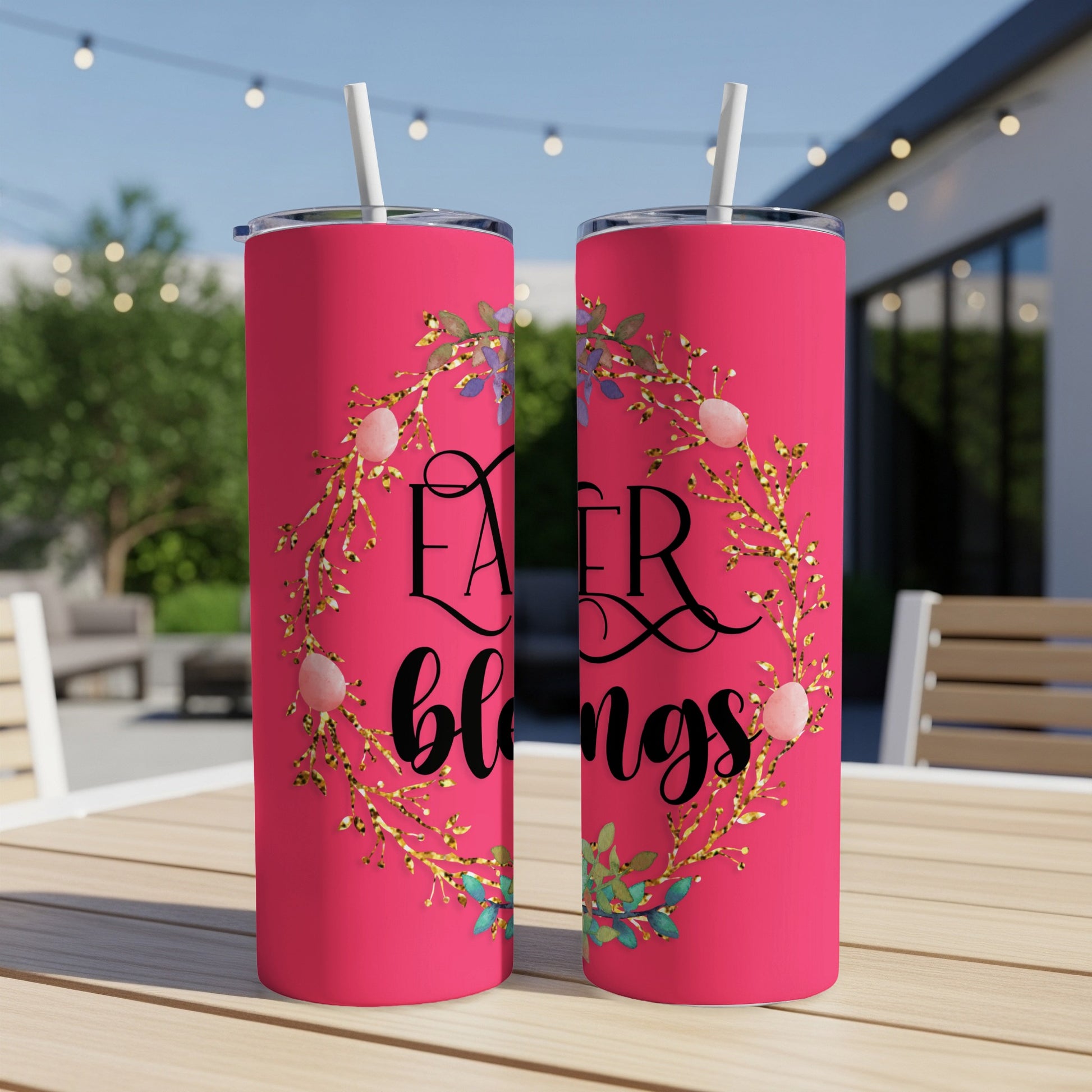 Pink tumbler with "Easter blessings" text and floral Easter egg wreath.
