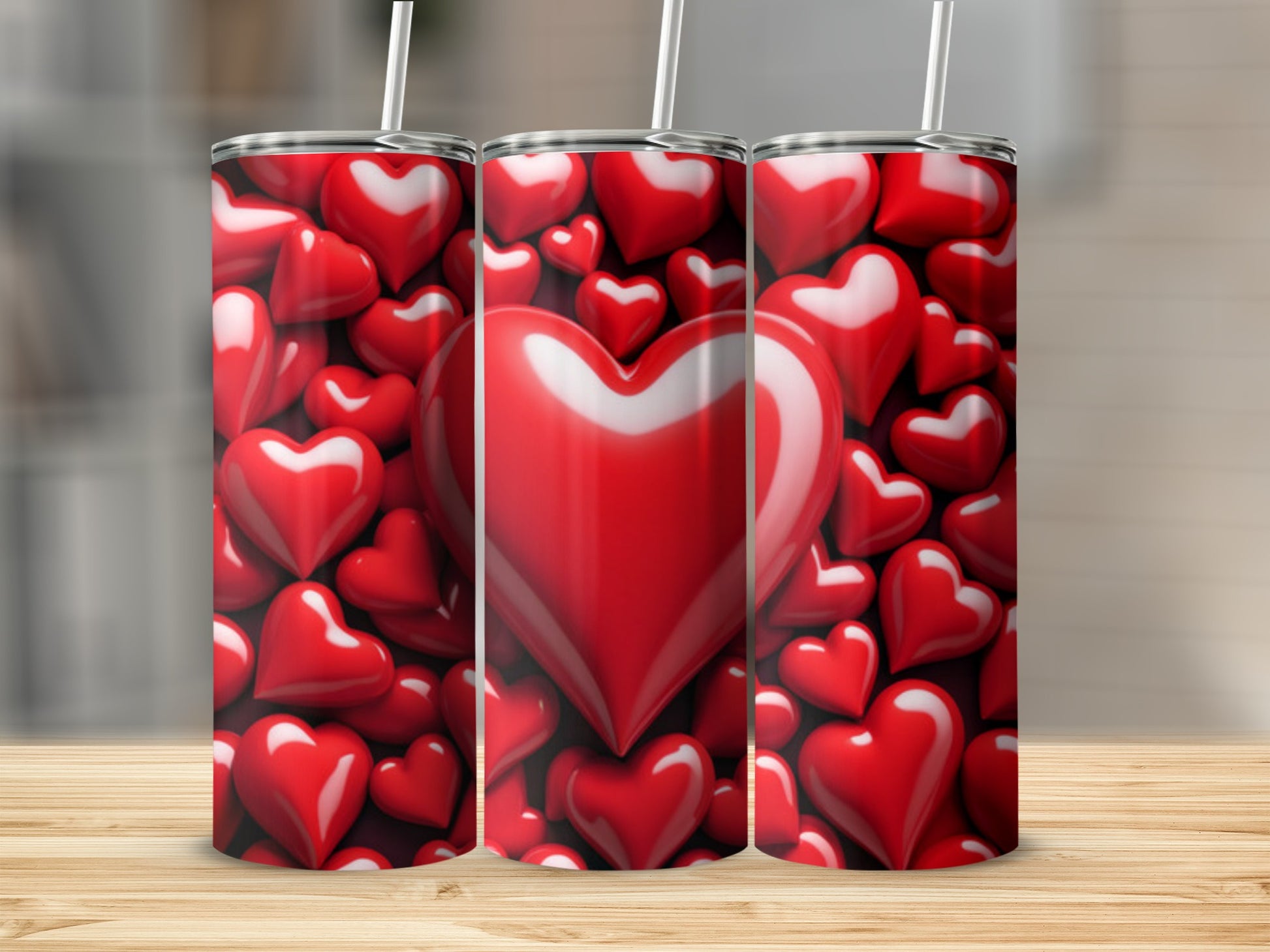 Three tumblers adorned with a repeating pattern of shiny red hearts.