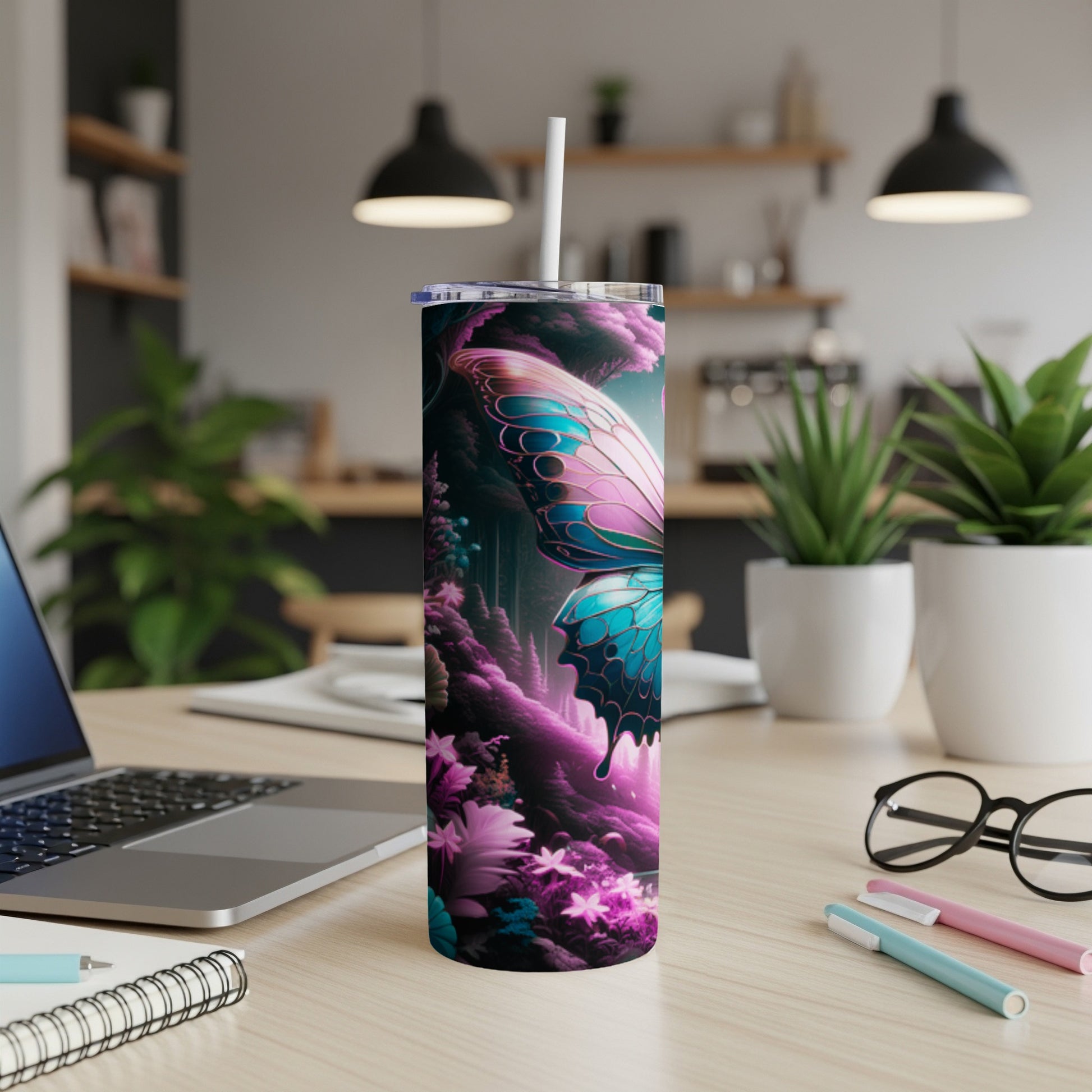 Tumbler with a large iridescent butterfly and vibrant floral fantasy background.