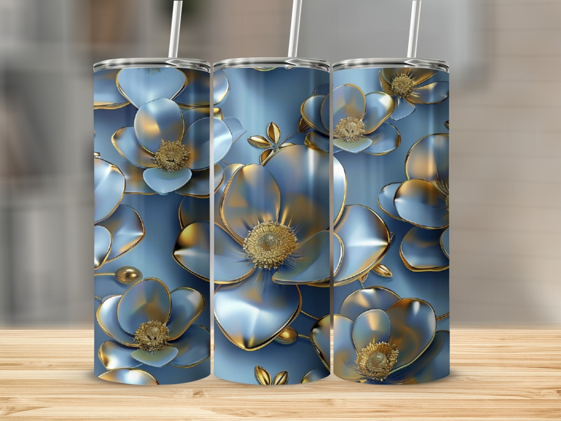 Blue floral tumbler with gold accents on a wooden surface.