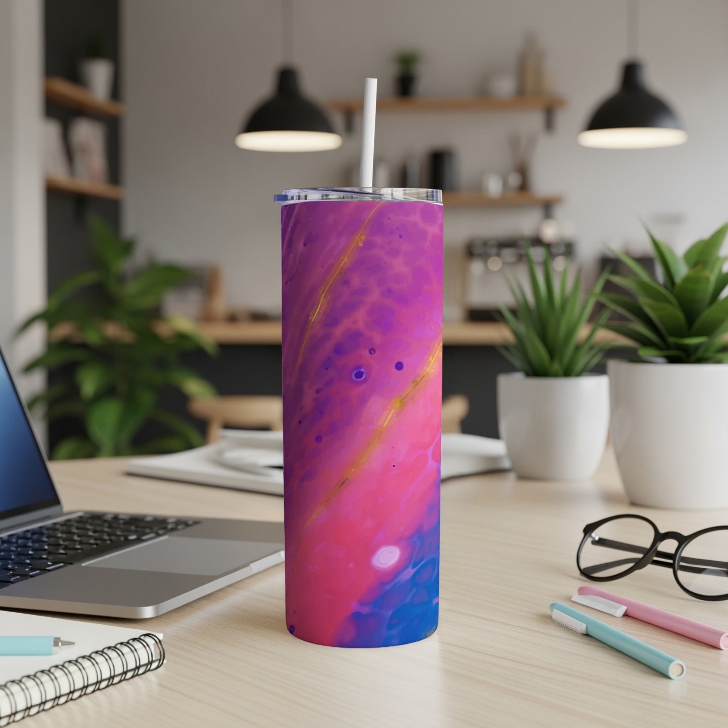Tumbler with pink, purple, and blue abstract design and gold accents.