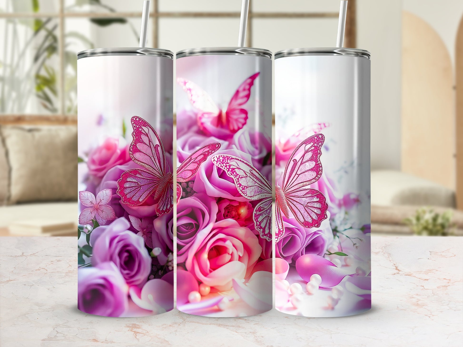 Three tumblers with pink roses and butterflies.