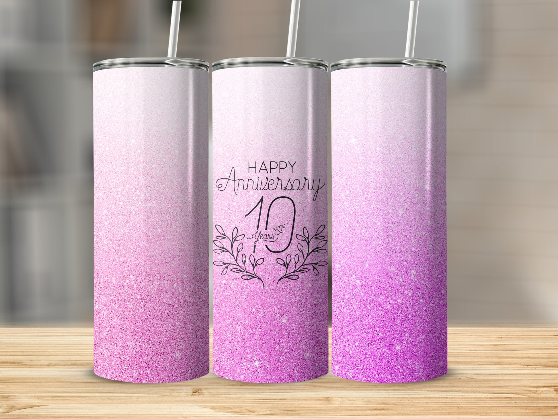 Three pink glitter tumblers with "Happy Anniversary 10 Years" text.