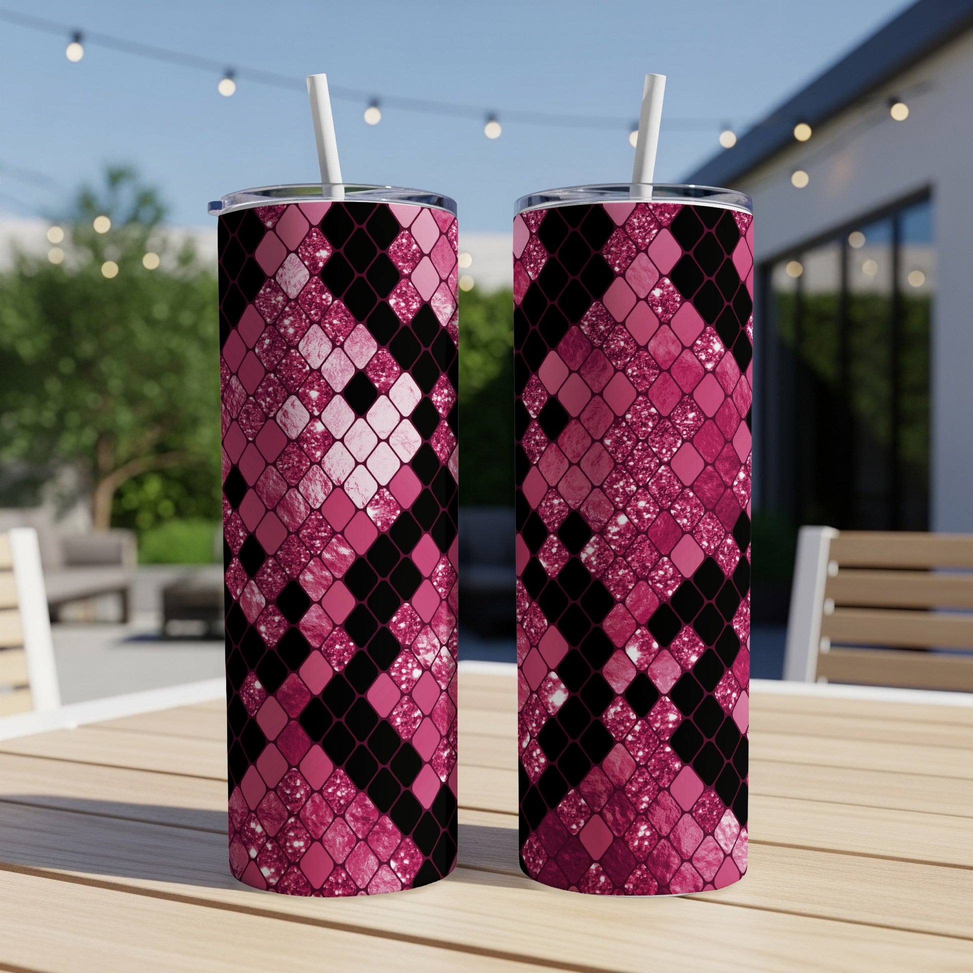 Two tall tumblers with pink and black diamond pattern and glitter accents.