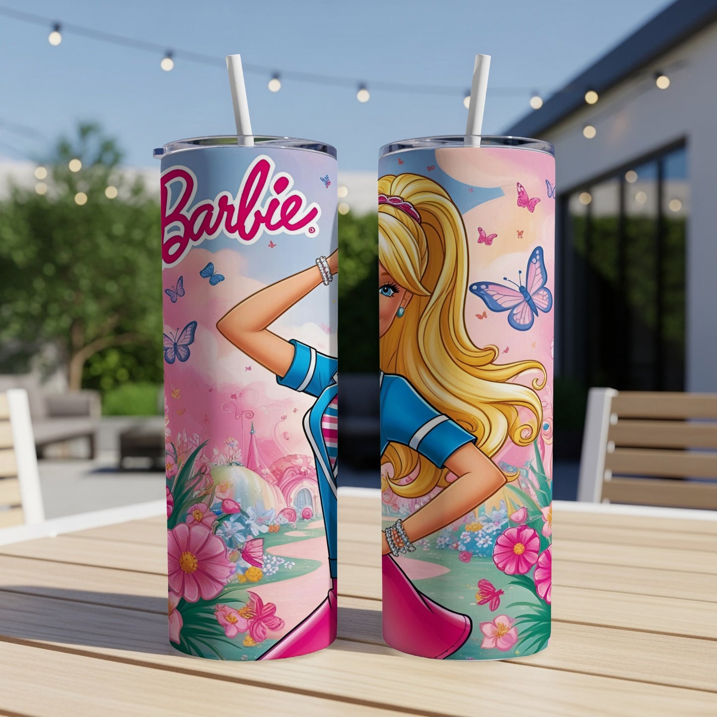 Barbie tumbler with pink butterflies, flowers, and a castle on a table.