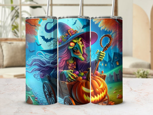 Three tumblers with a spooky witch and pumpkins design on a marble surface.