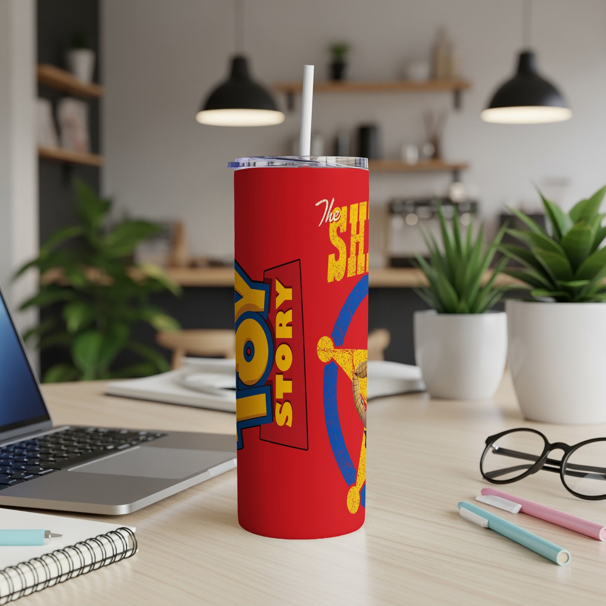 Red tumbler with Toy Story logo and Sheriff Woody illustration.
