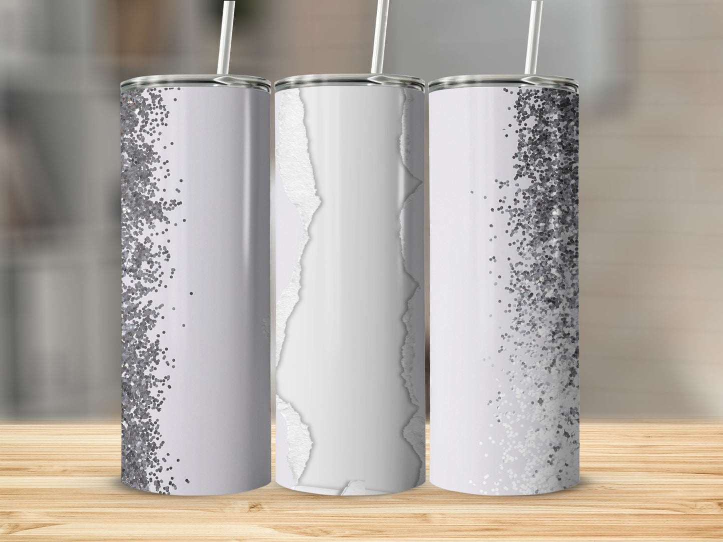Three tumblers with silver glitter and ripped paper designs.