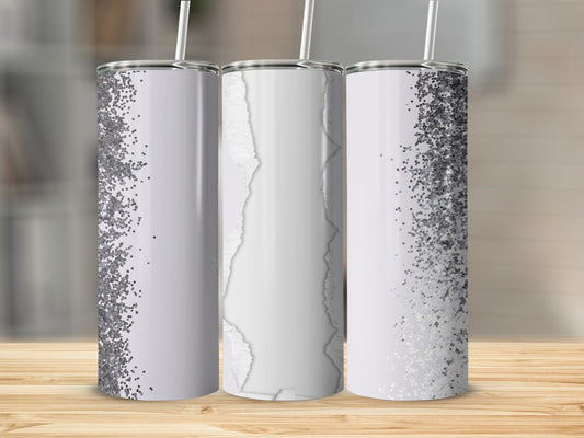 Three tumblers with silver glitter and ripped paper designs.