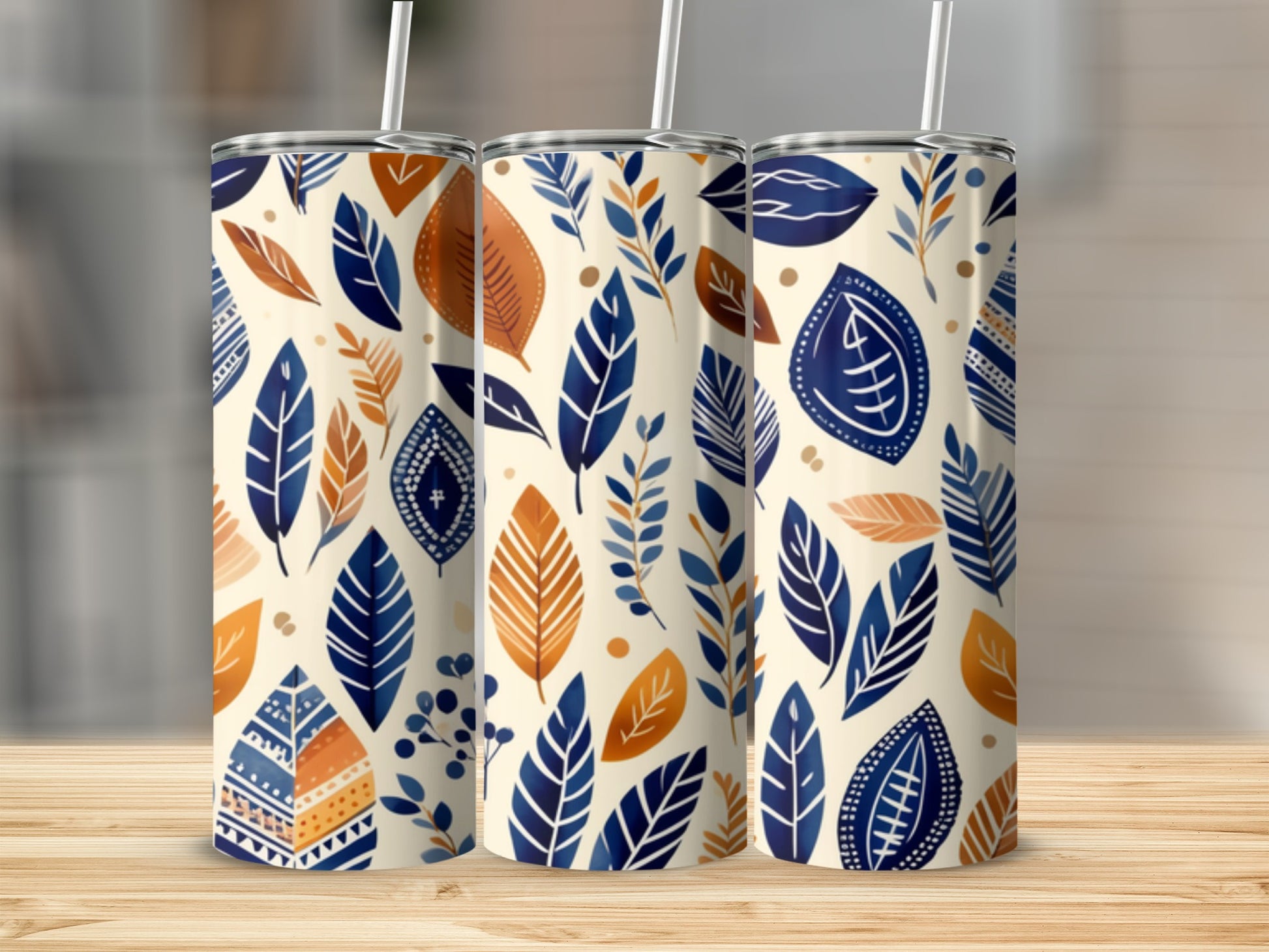 Three tumblers with blue and orange leaf pattern.