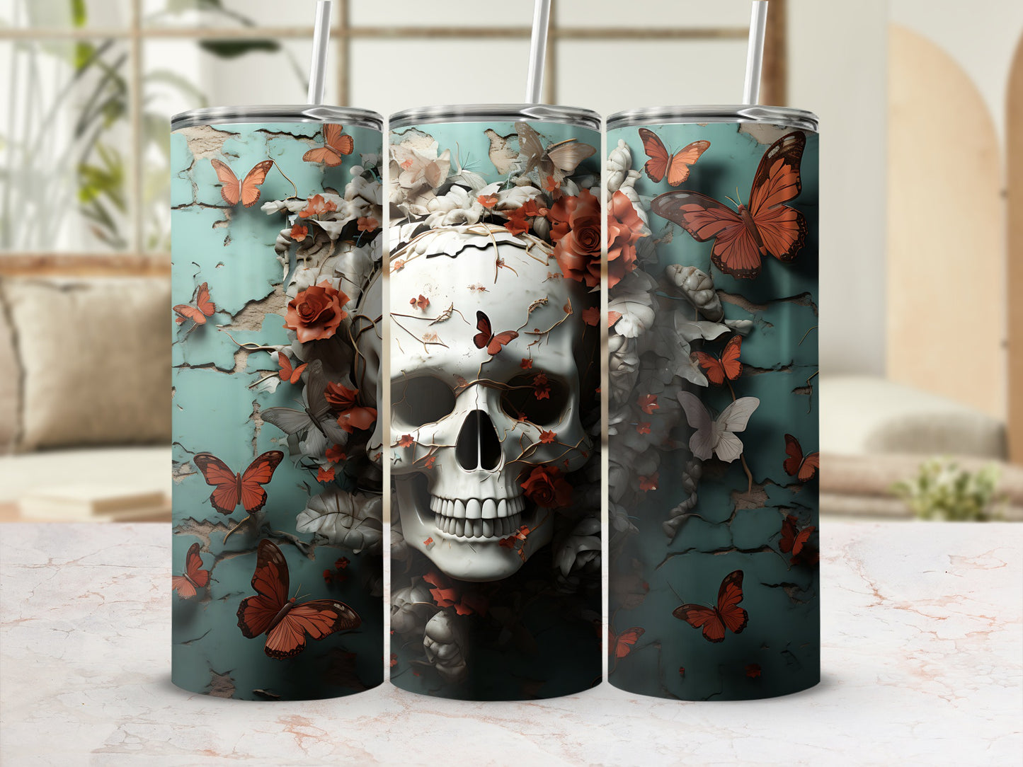 Skull and butterflies design on three tumblers with straws.