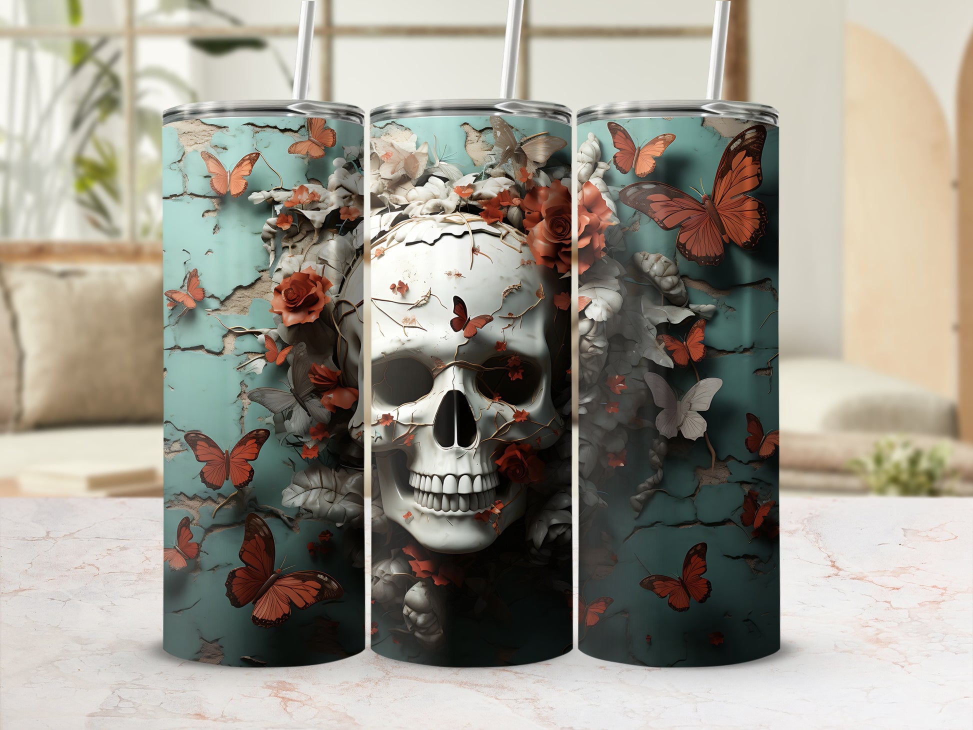 Skull and butterflies design on three tumblers with straws.