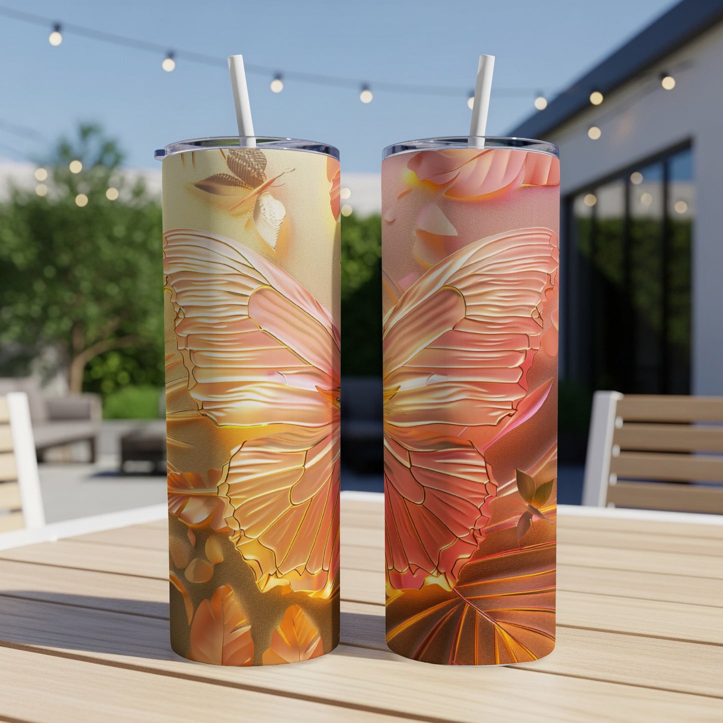 Two tall tumblers with a vibrant orange and gold butterfly wing design.