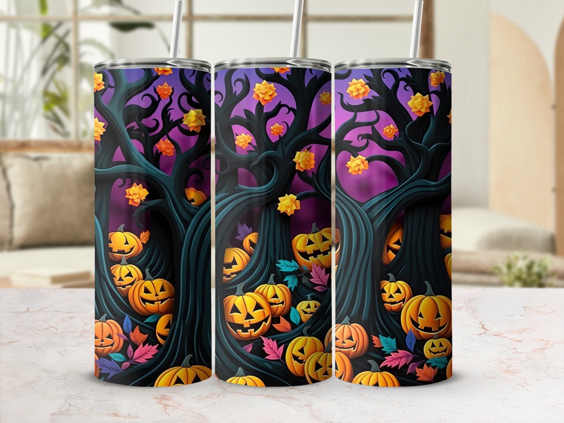Three tumblers with a Halloween design featuring jack-o'-lanterns and spooky trees.