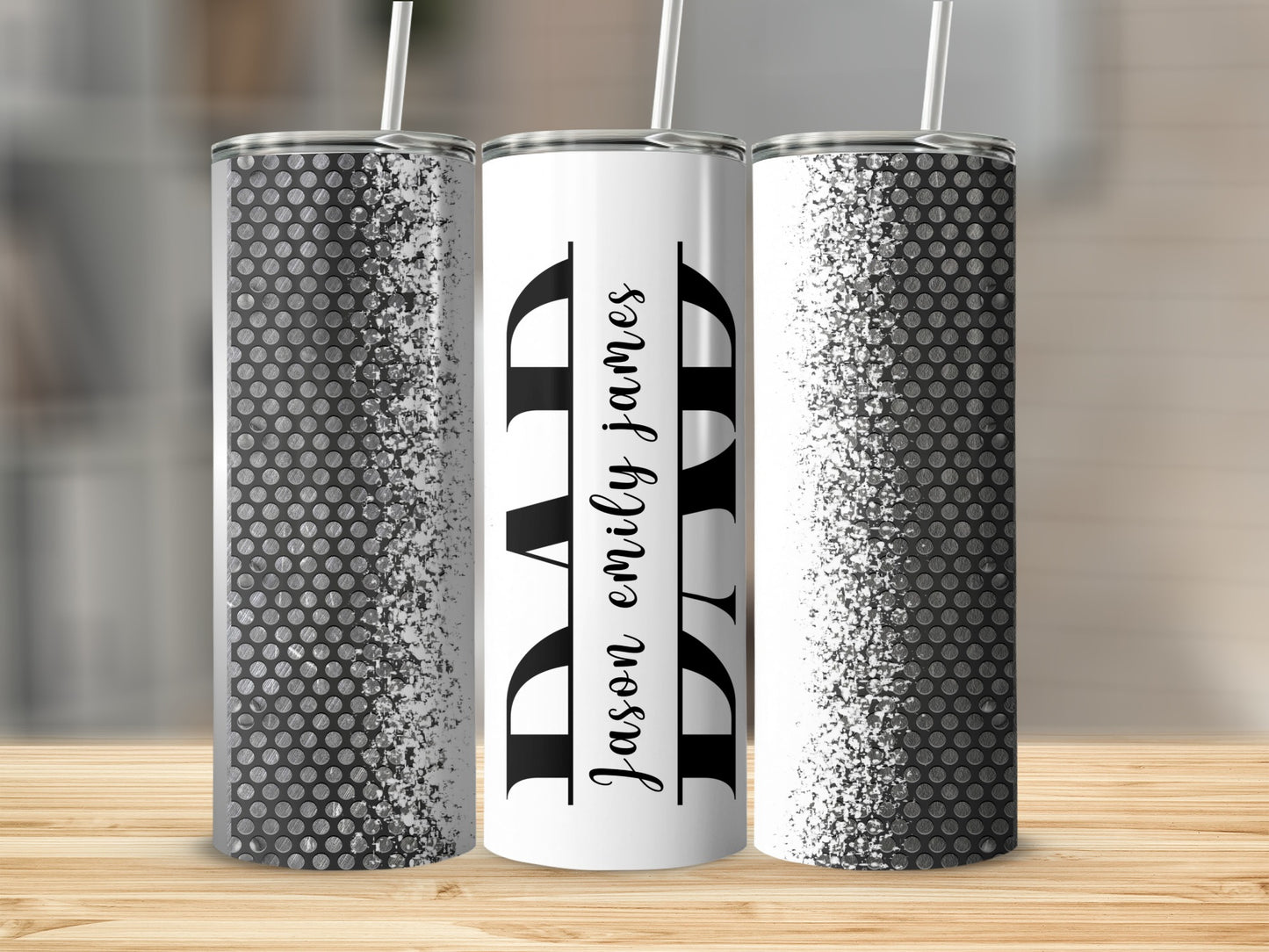 Tumblers with a black and white dotted pattern, one featuring "DAD" and "Jason Emily James" text.