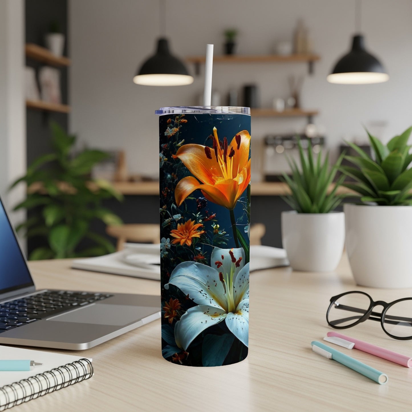 Tall tumbler with orange and white lilies against a dark background.