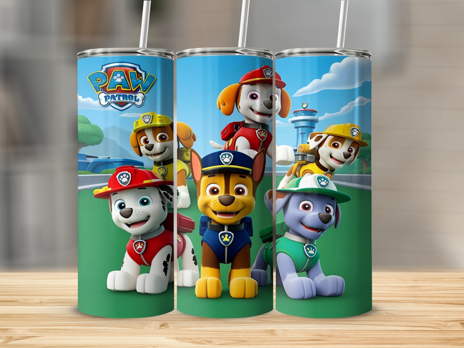 Paw Patrol characters Chase, Marshall, and Rubble on a stainless steel tumbler.