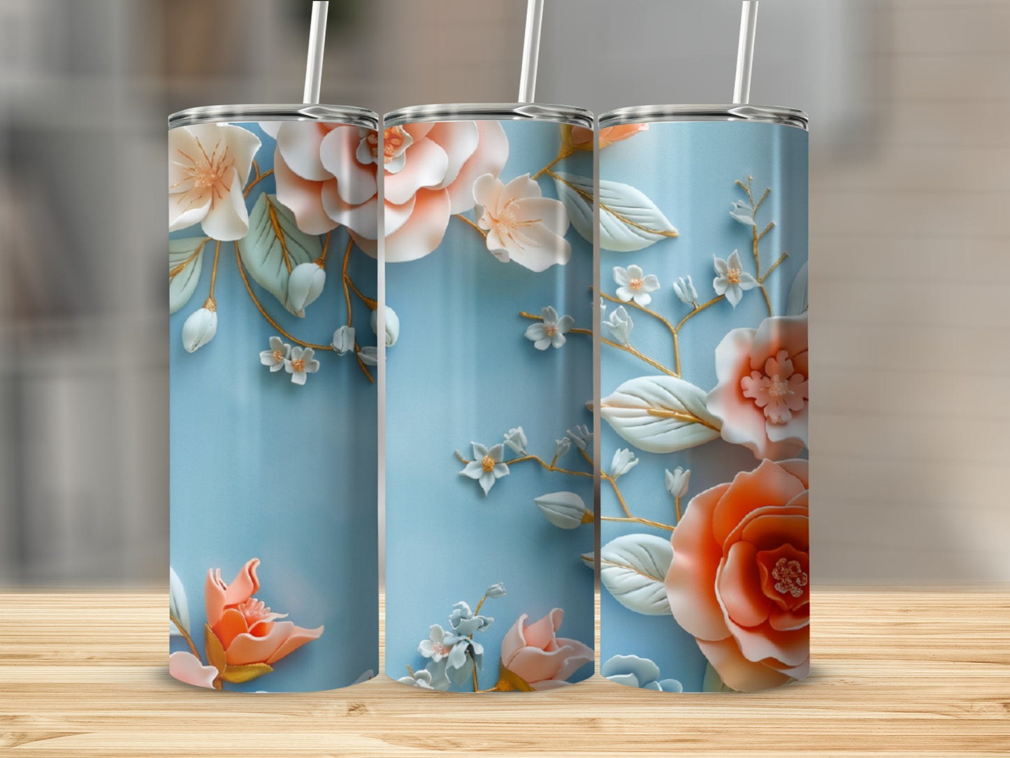 Blue tumbler with raised 3D floral design in coral and cream.