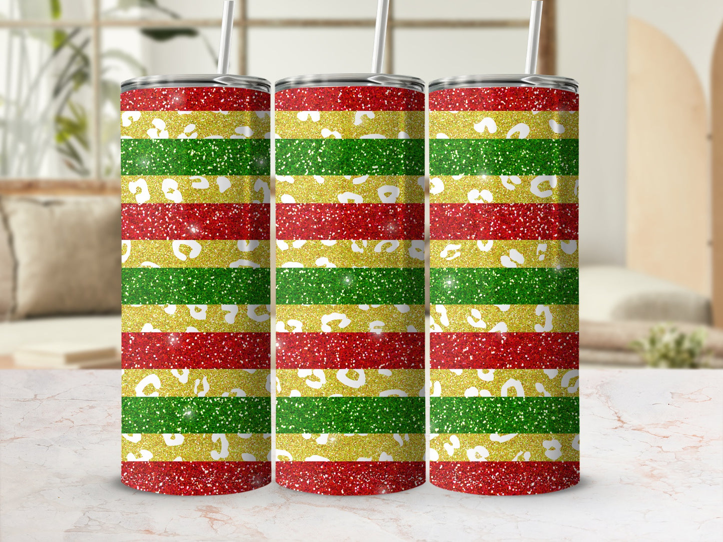 Three tumblers with red, yellow, and green glitter stripes.