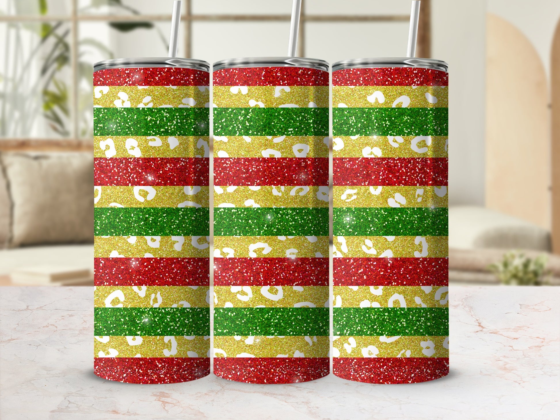 Three tumblers with red, yellow, and green glitter stripes.