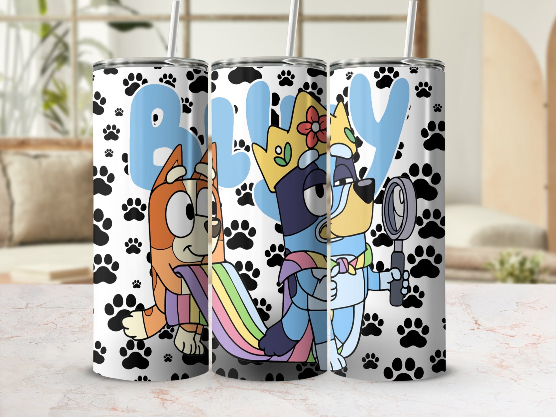 Bluey and Bingo characters on tumblers with paw print background.