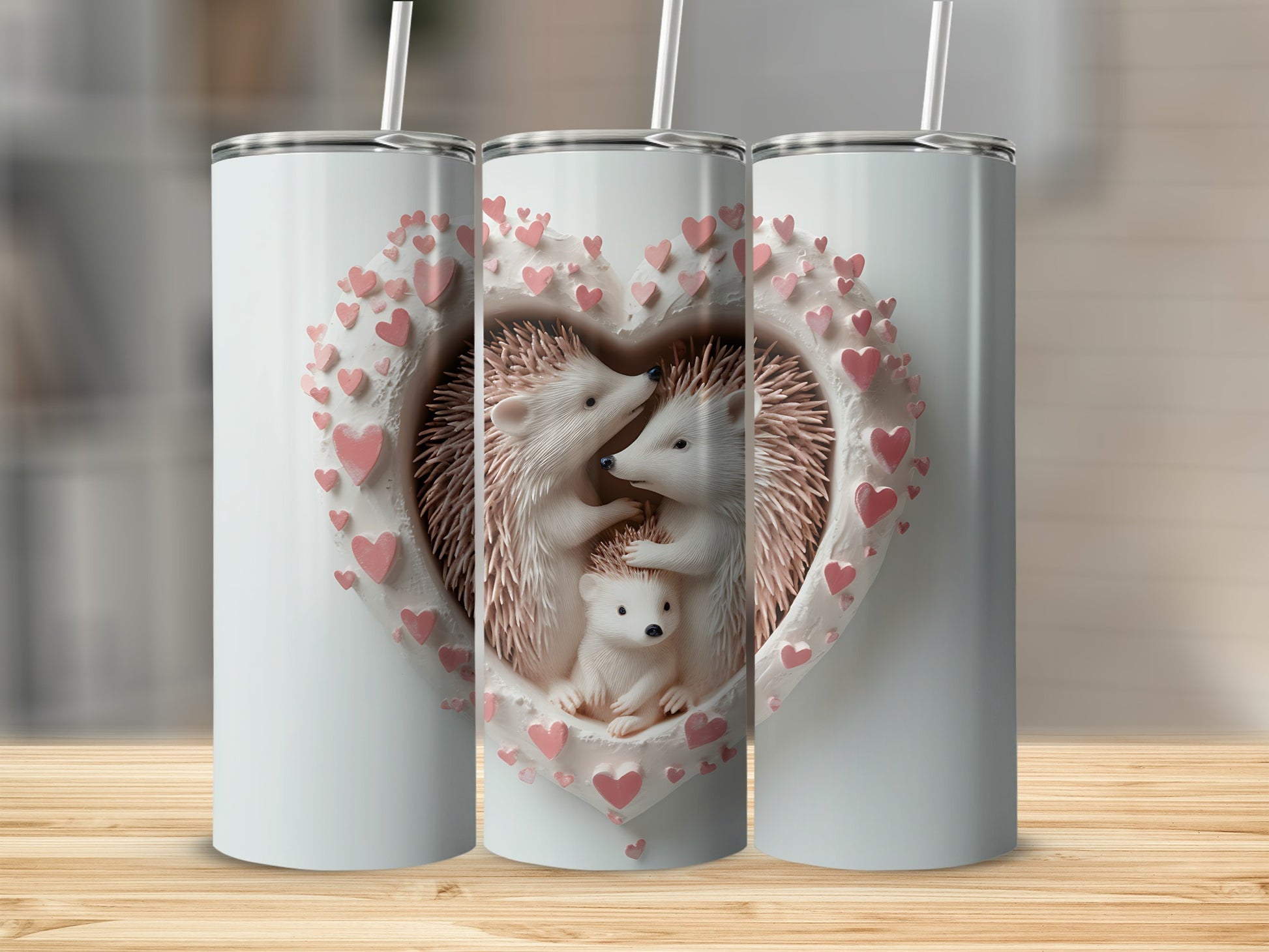 Three tumblers featuring a heart-shaped design with hedgehogs and pink hearts.
