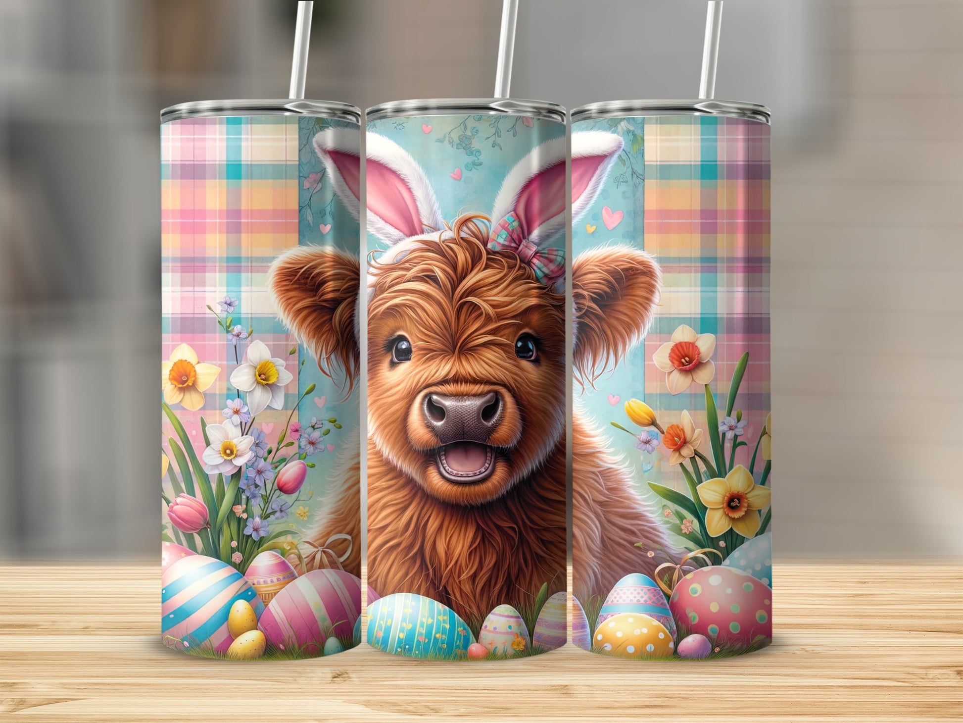 Cute Highland cow with bunny ears on Easter-themed tumblers.